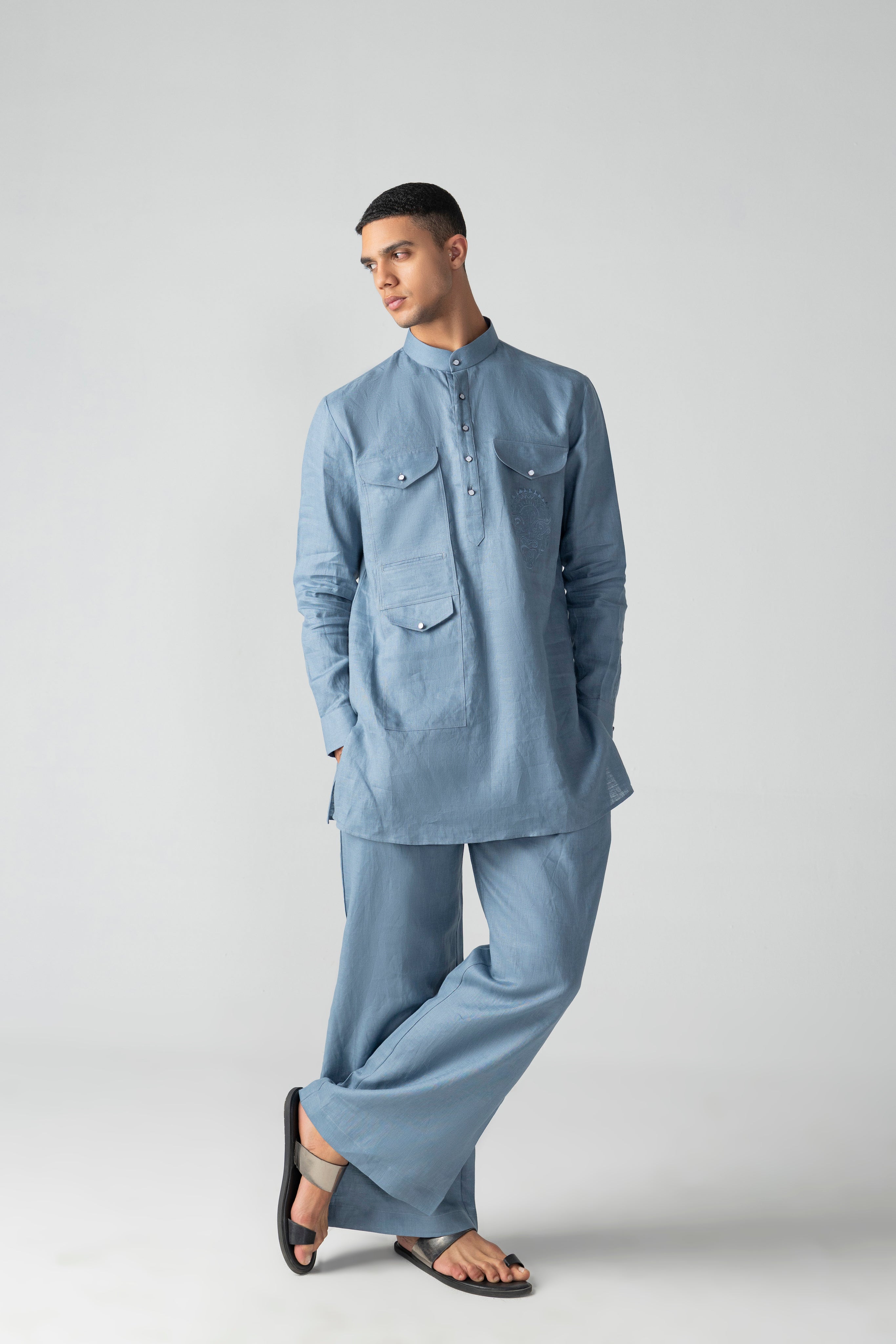 Navy blue linen short kurta with patch pocket & thread embroidery detailing, paired with a matching plazzo