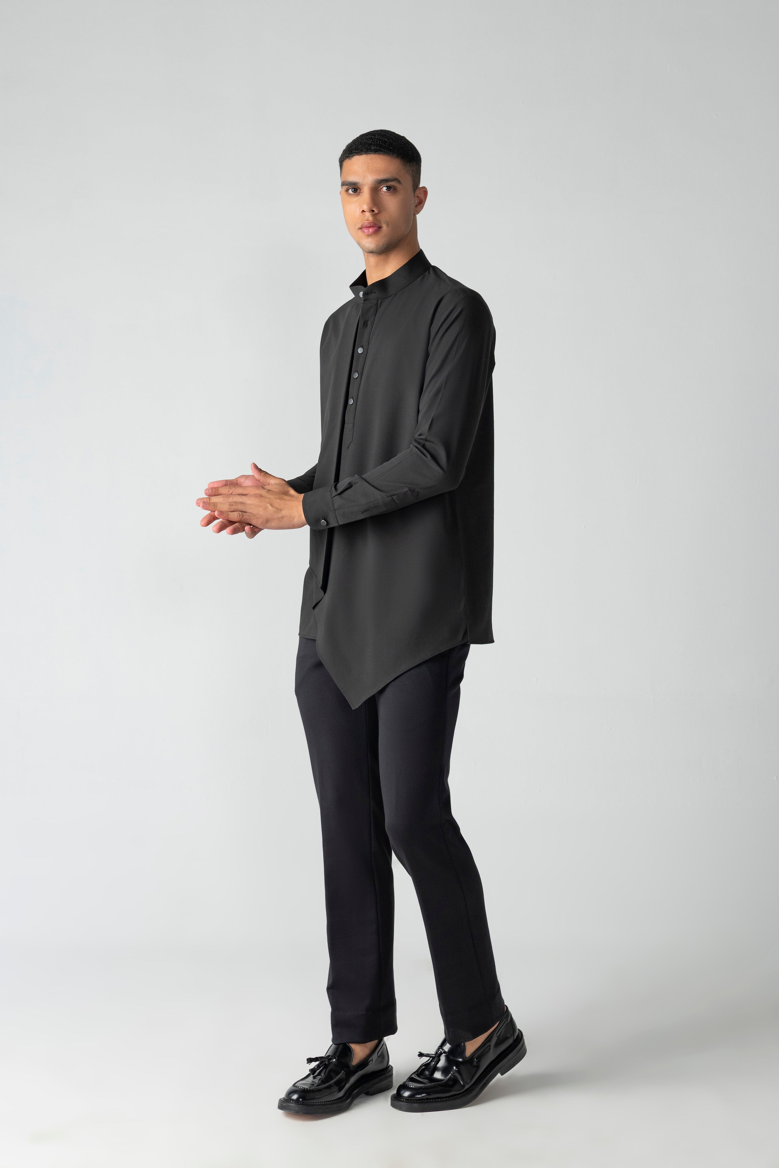 Black shirt with asymmetrical cuts & drapes