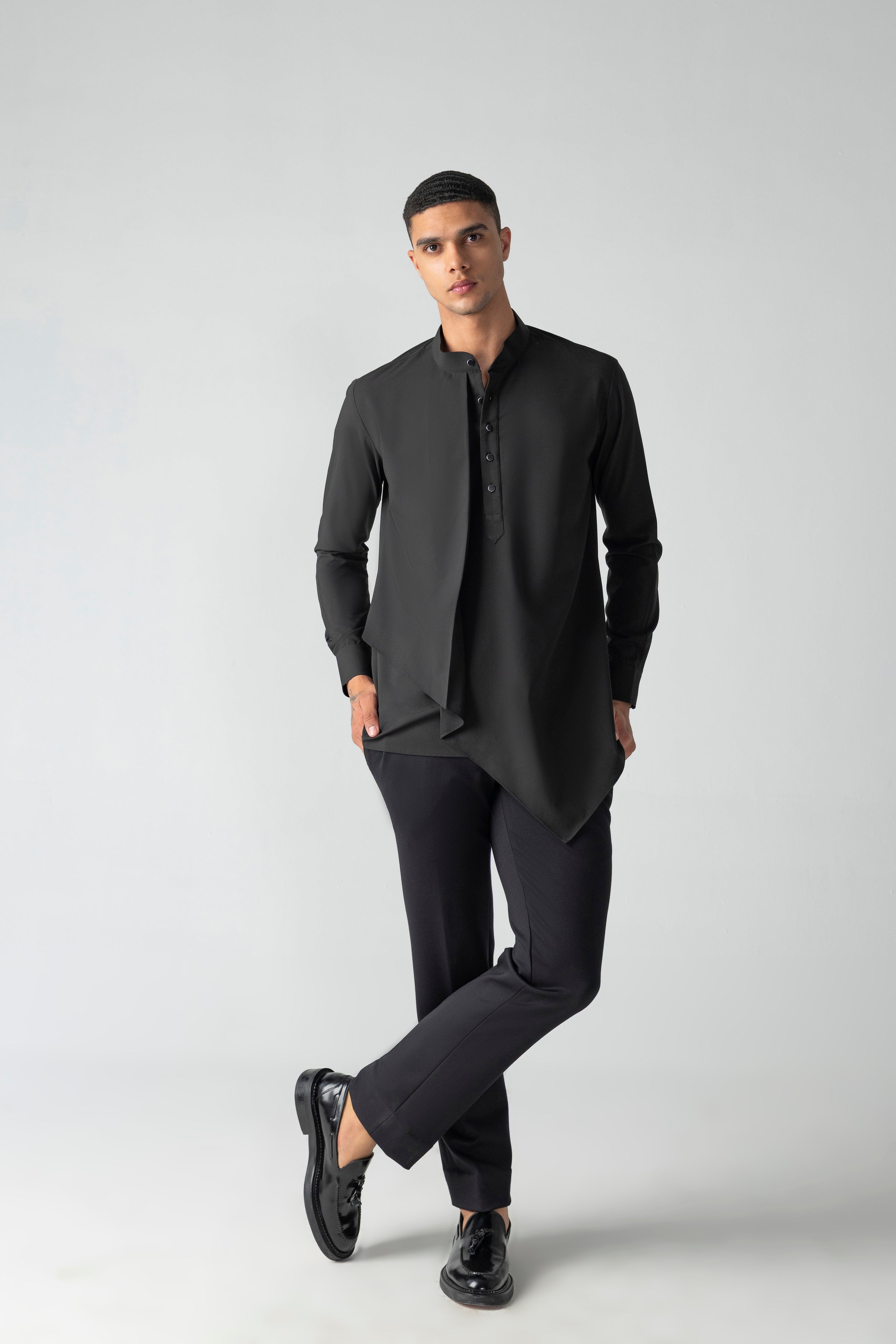 Black shirt with asymmetrical cuts & drapes