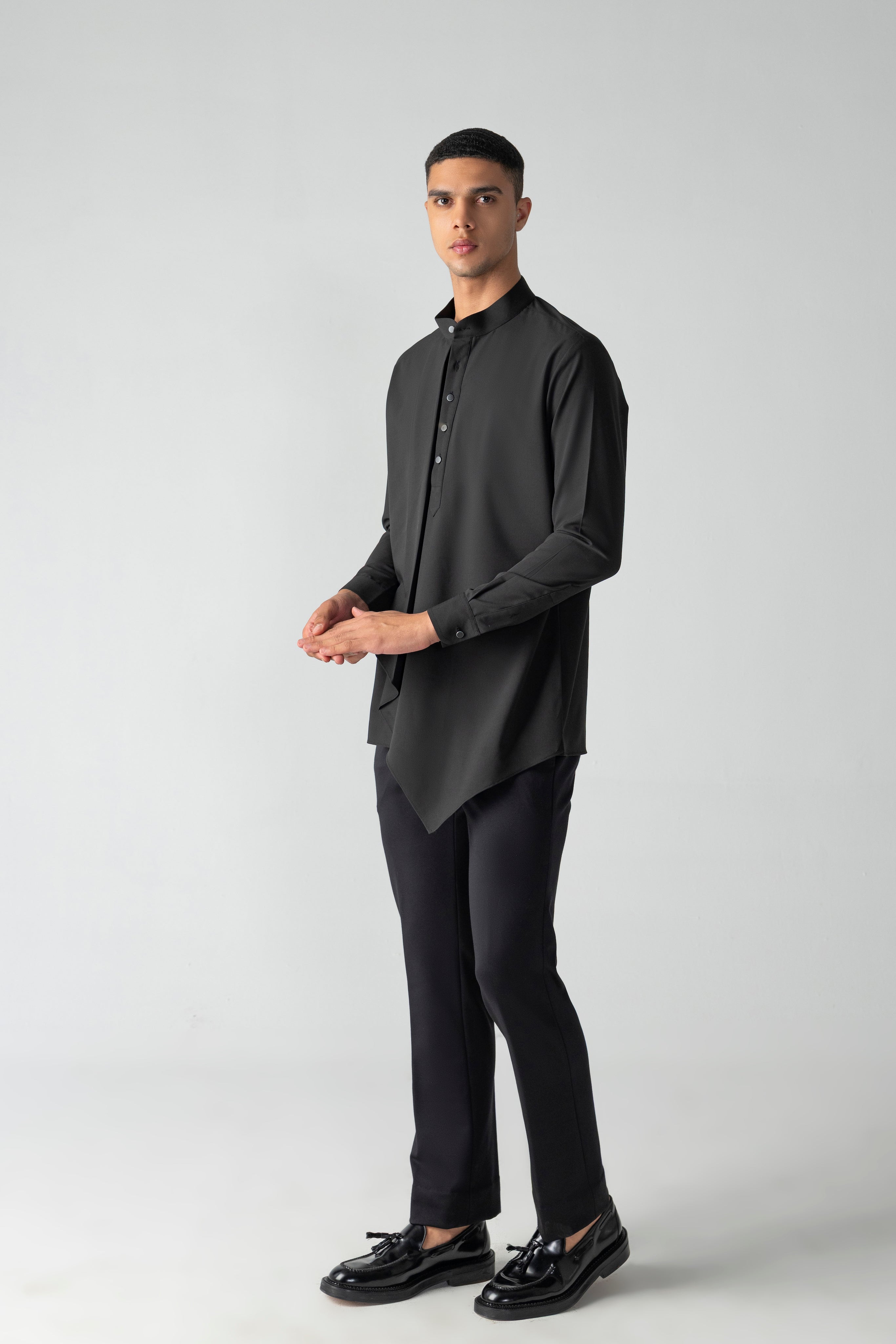 Black shirt with asymmetrical cuts & drapes