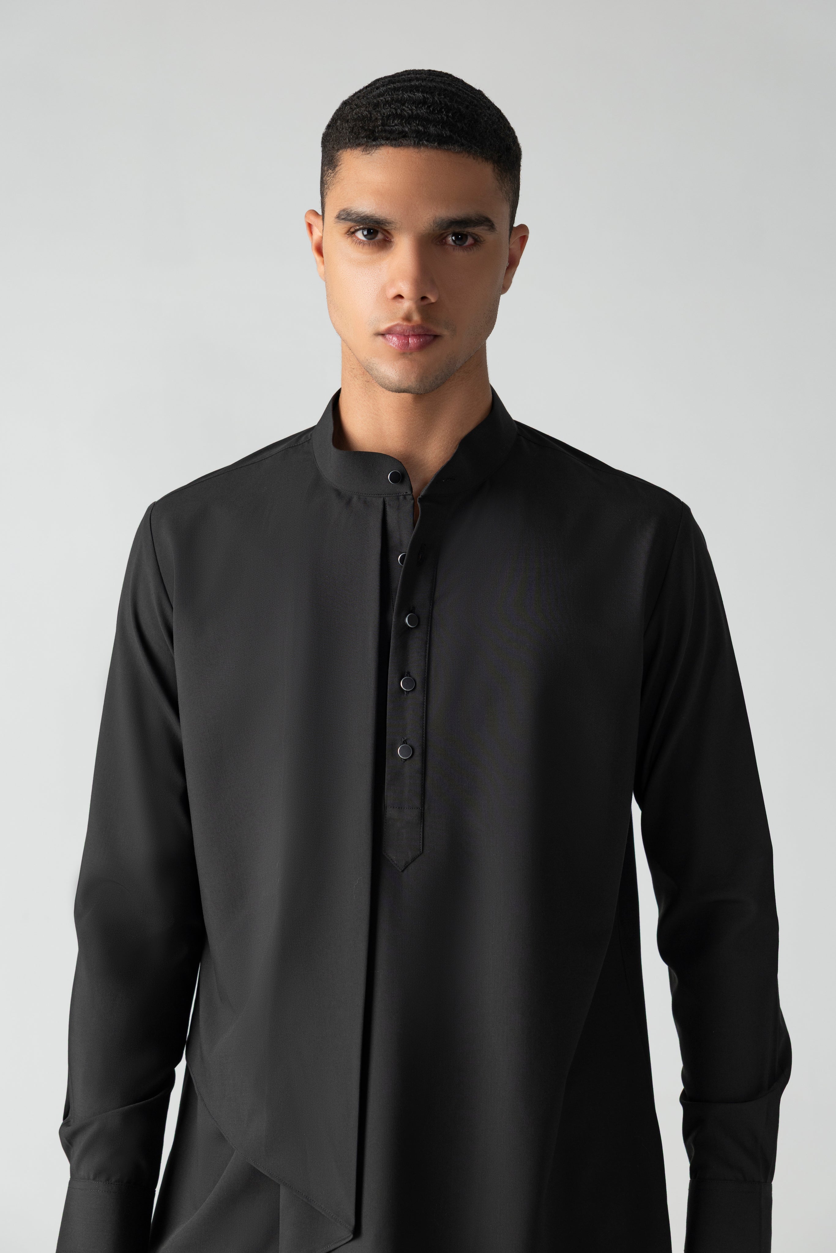 Black shirt with asymmetrical cuts & drapes