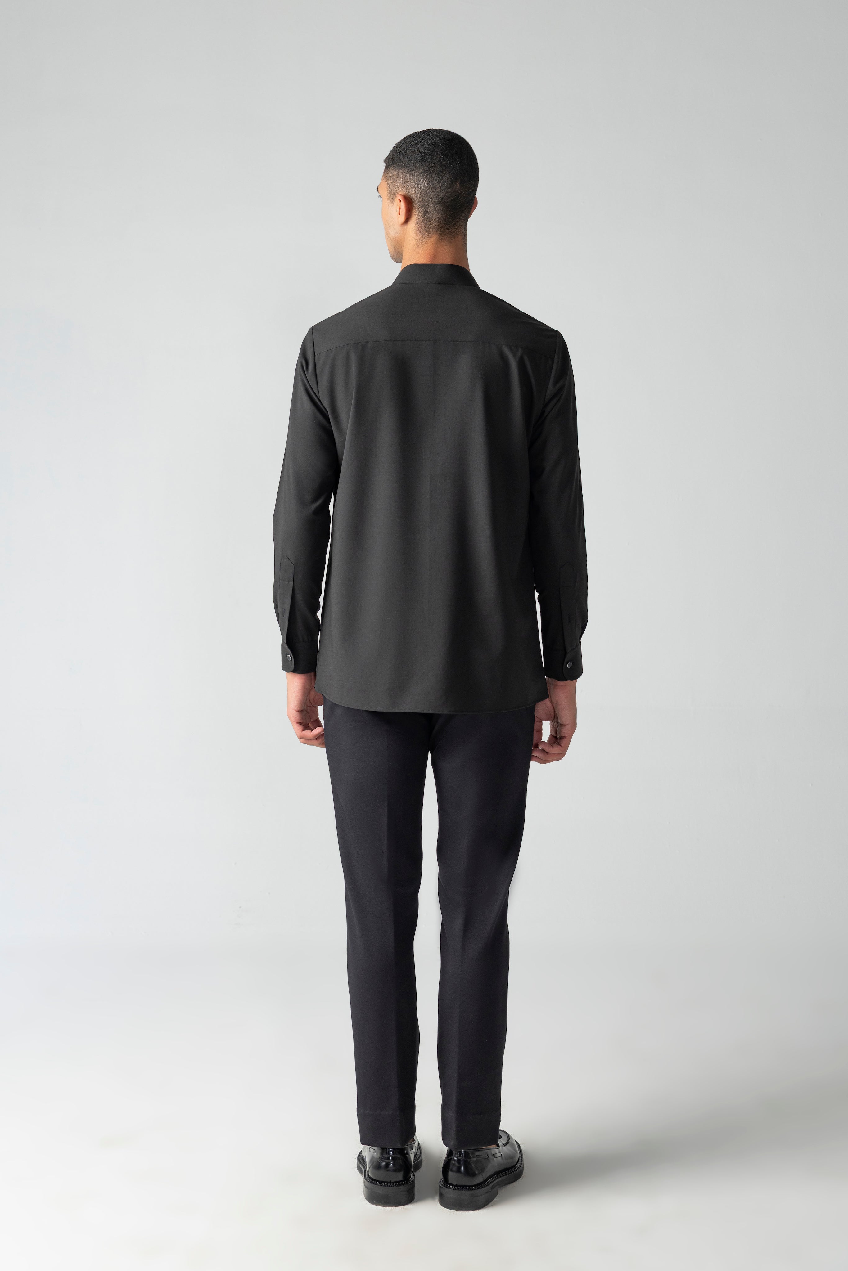 Black shirt with asymmetrical cuts & drapes