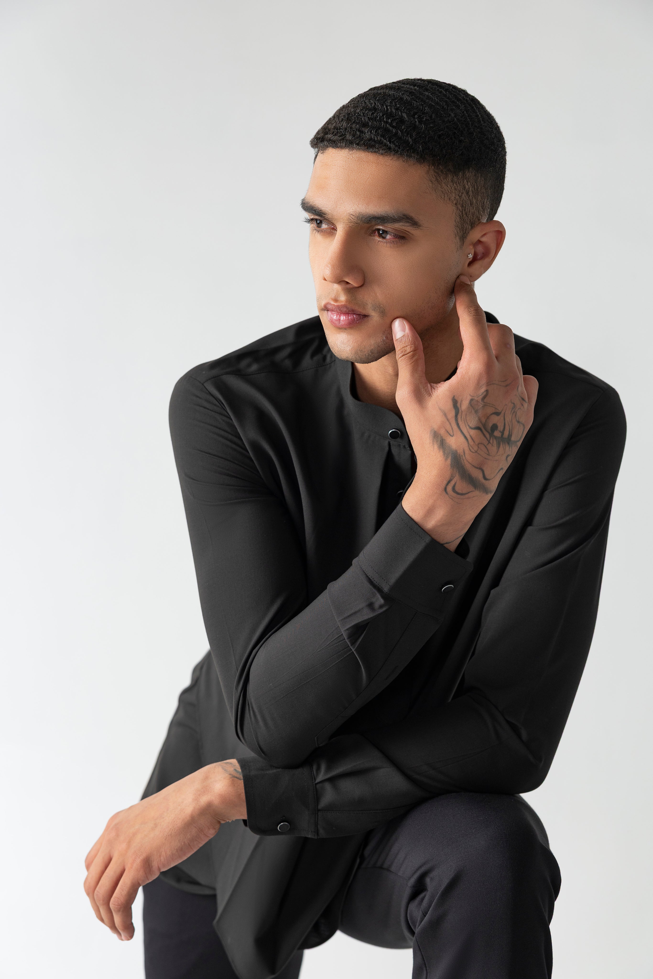 Black shirt with asymmetrical cuts & drapes
