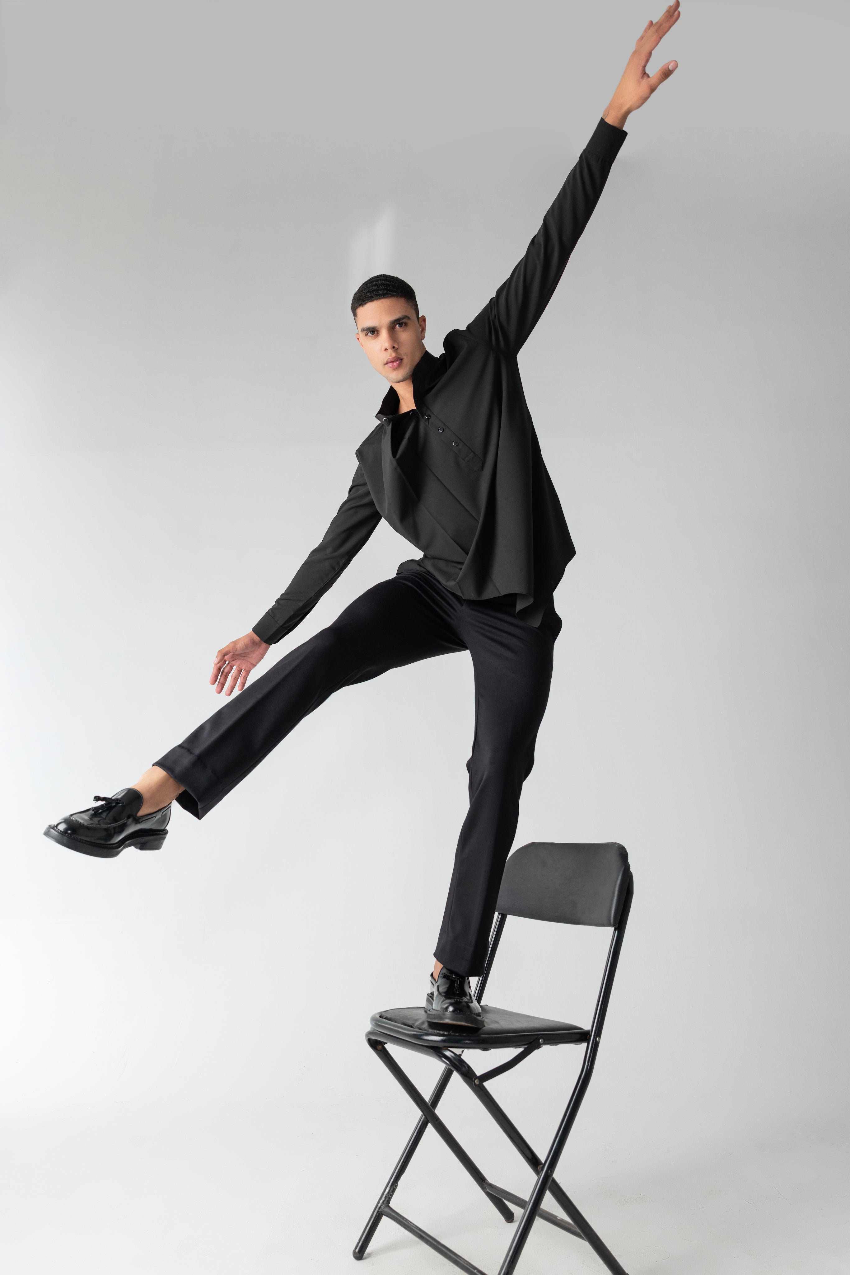Black shirt with asymmetrical cuts & drapes