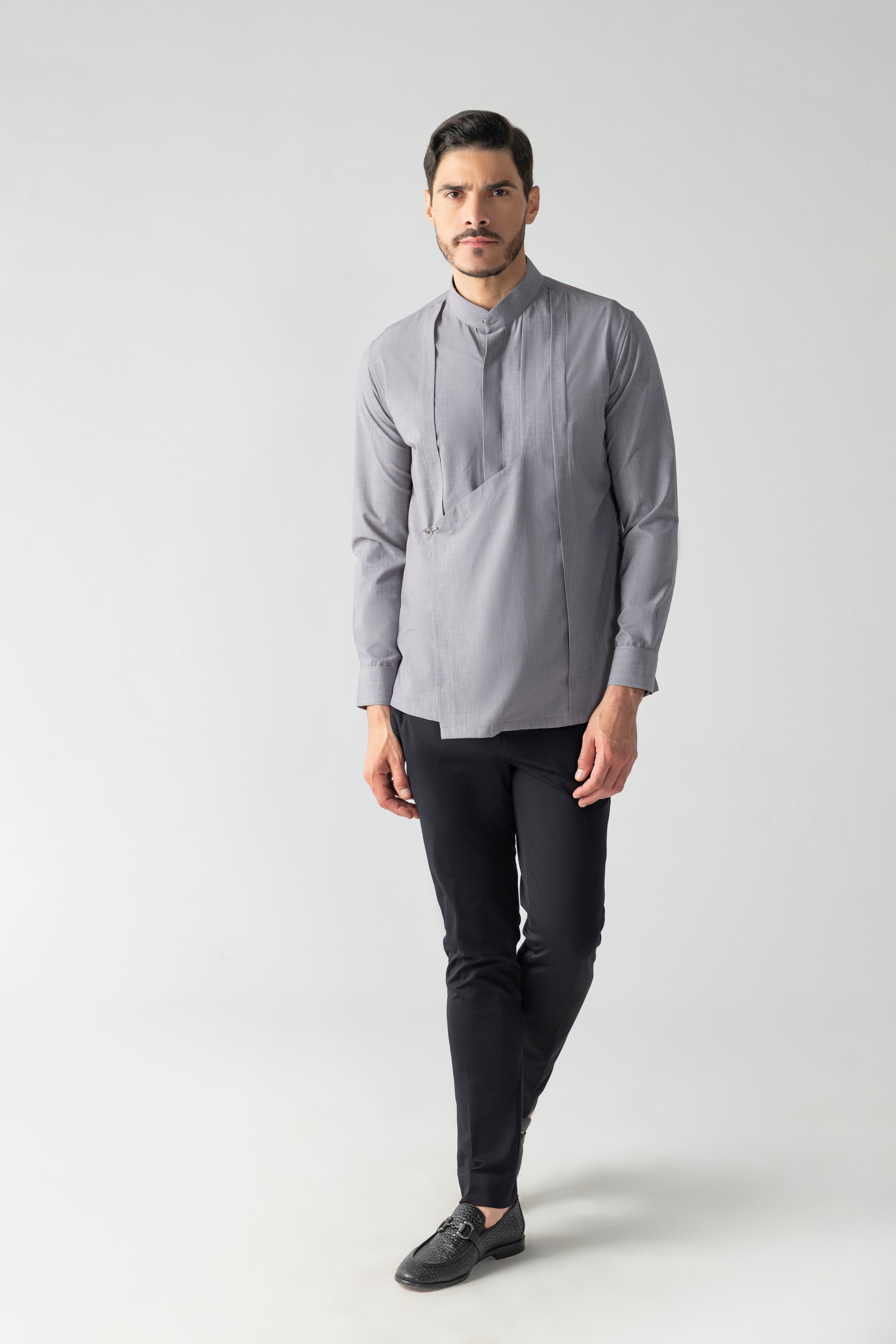 Grey shirt with asymmetrical flap, pleating & hook detailing