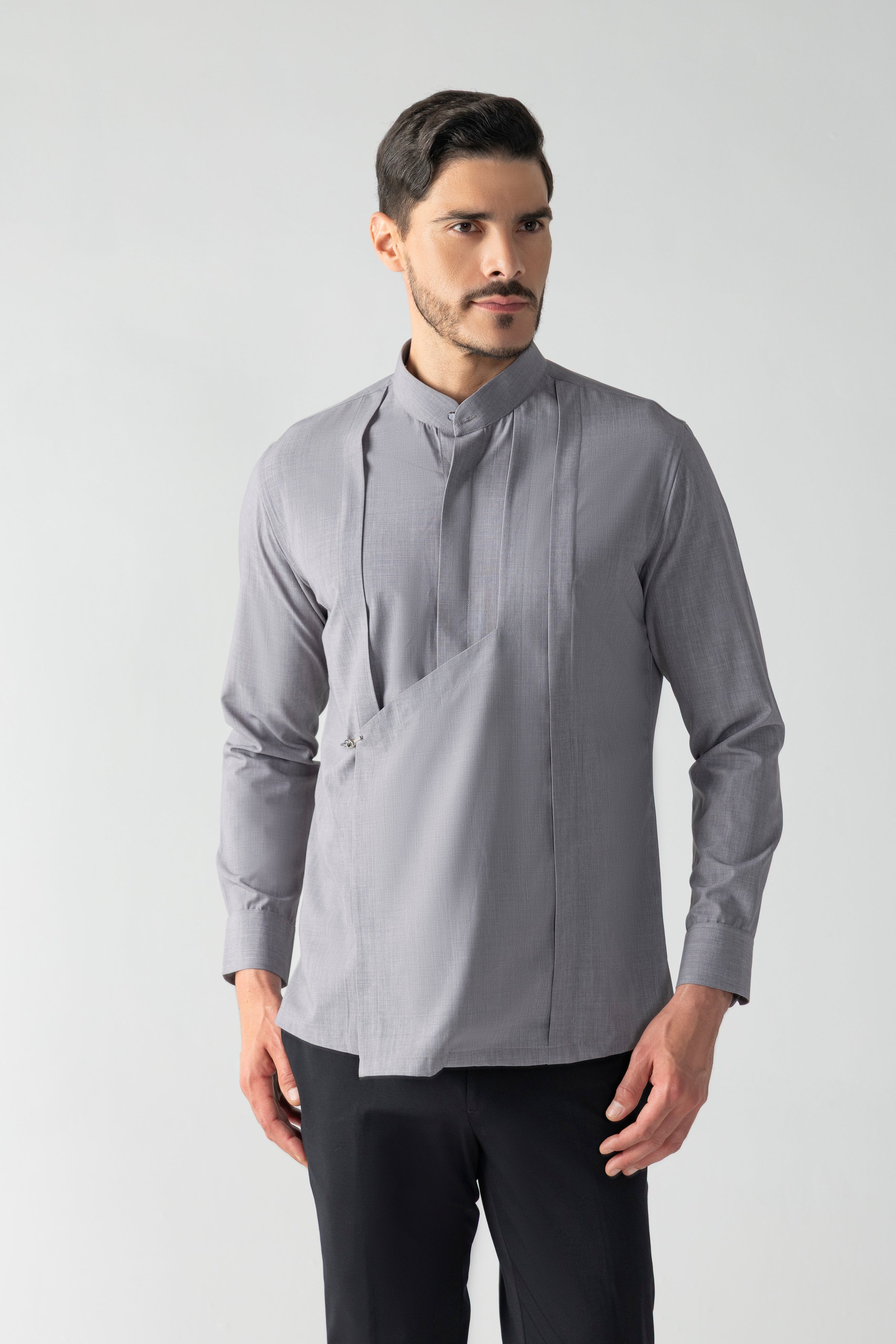 Grey shirt with asymmetrical flap, pleating & hook detailing