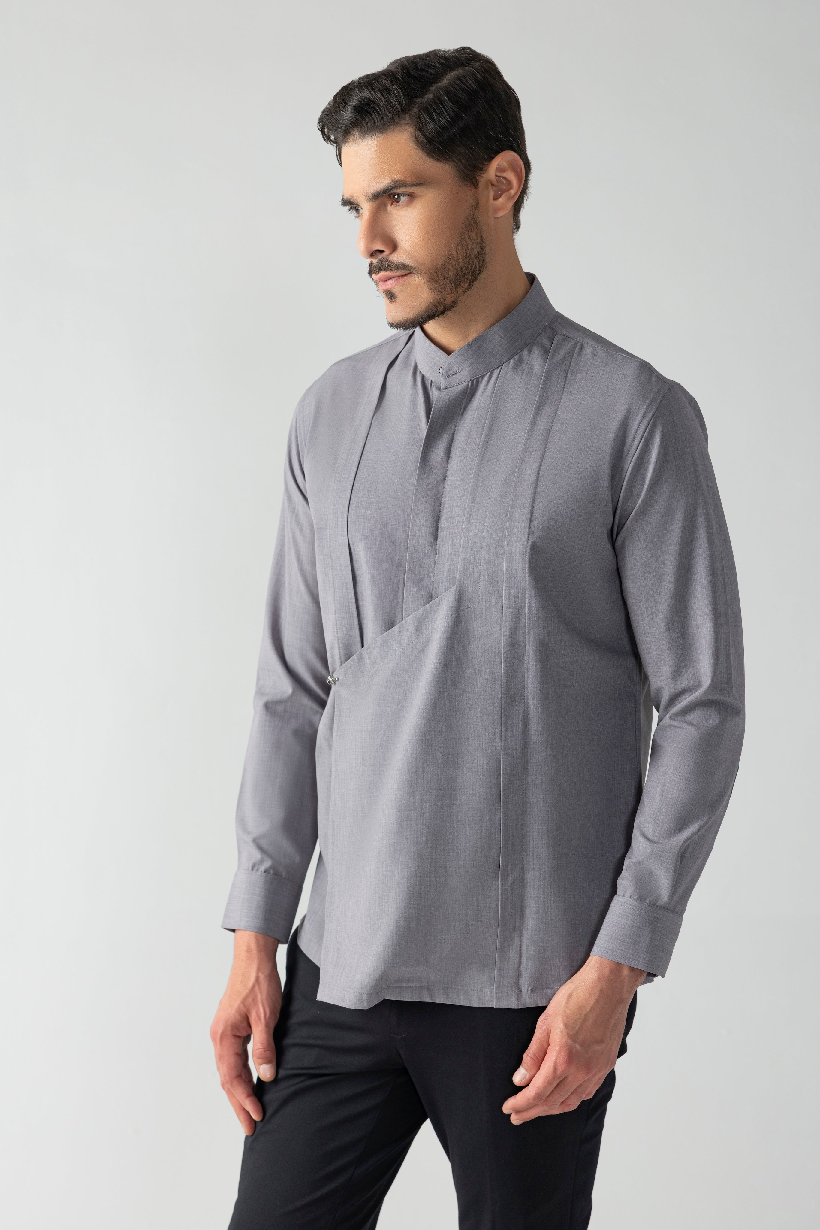 Grey shirt with asymmetrical flap, pleating & hook detailing