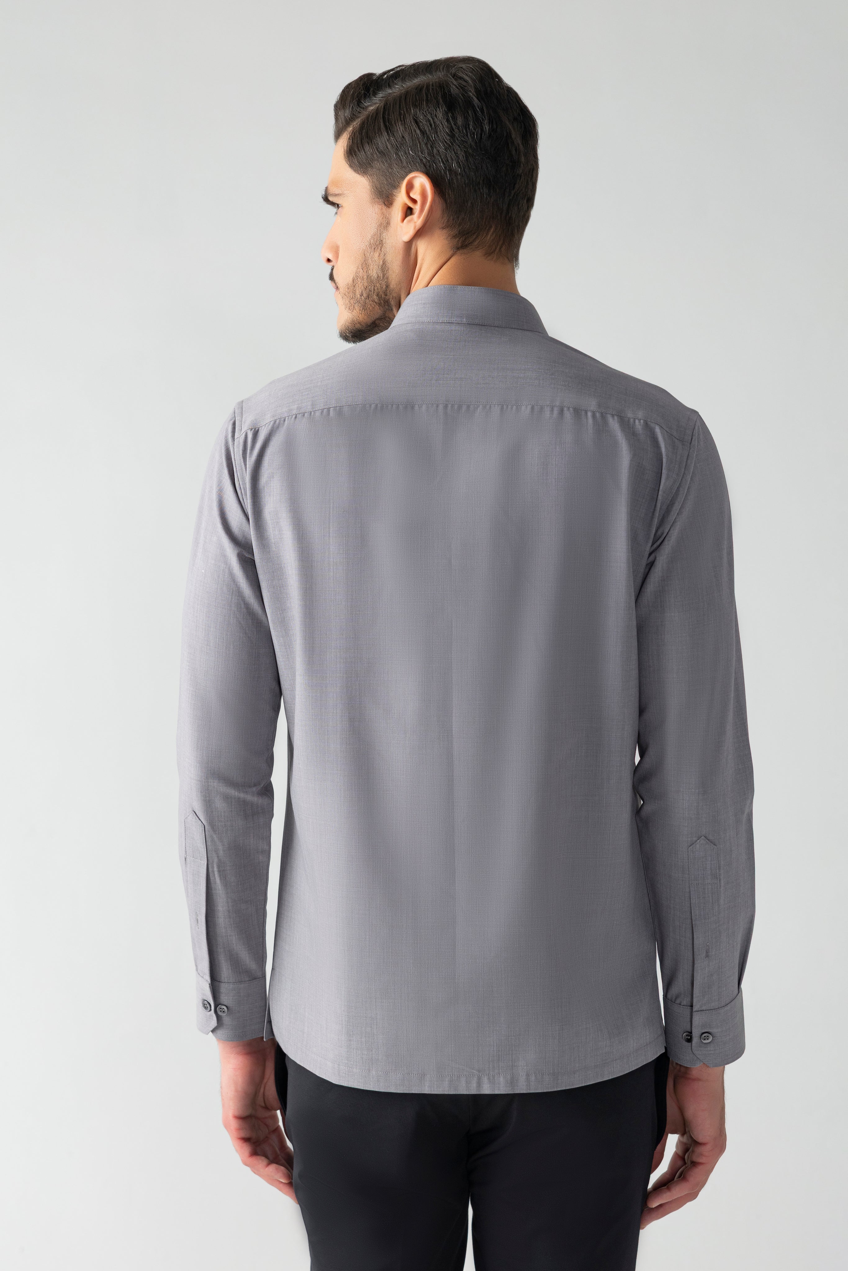 Grey shirt with asymmetrical flap, pleating & hook detailing