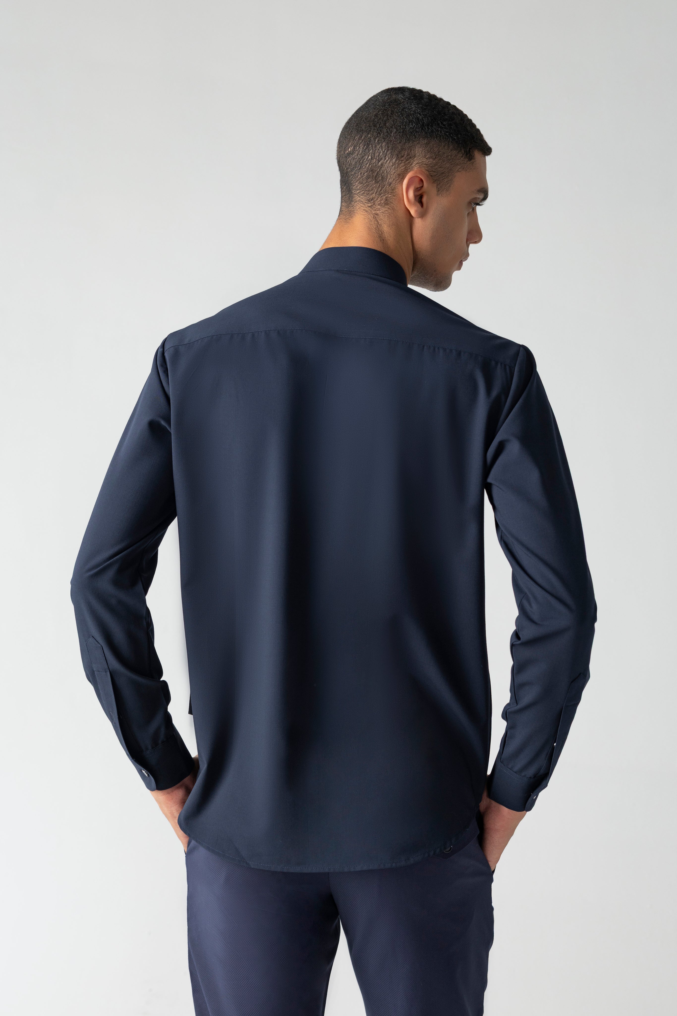 Navy blue shirt with asymmetrical cuts & drapes