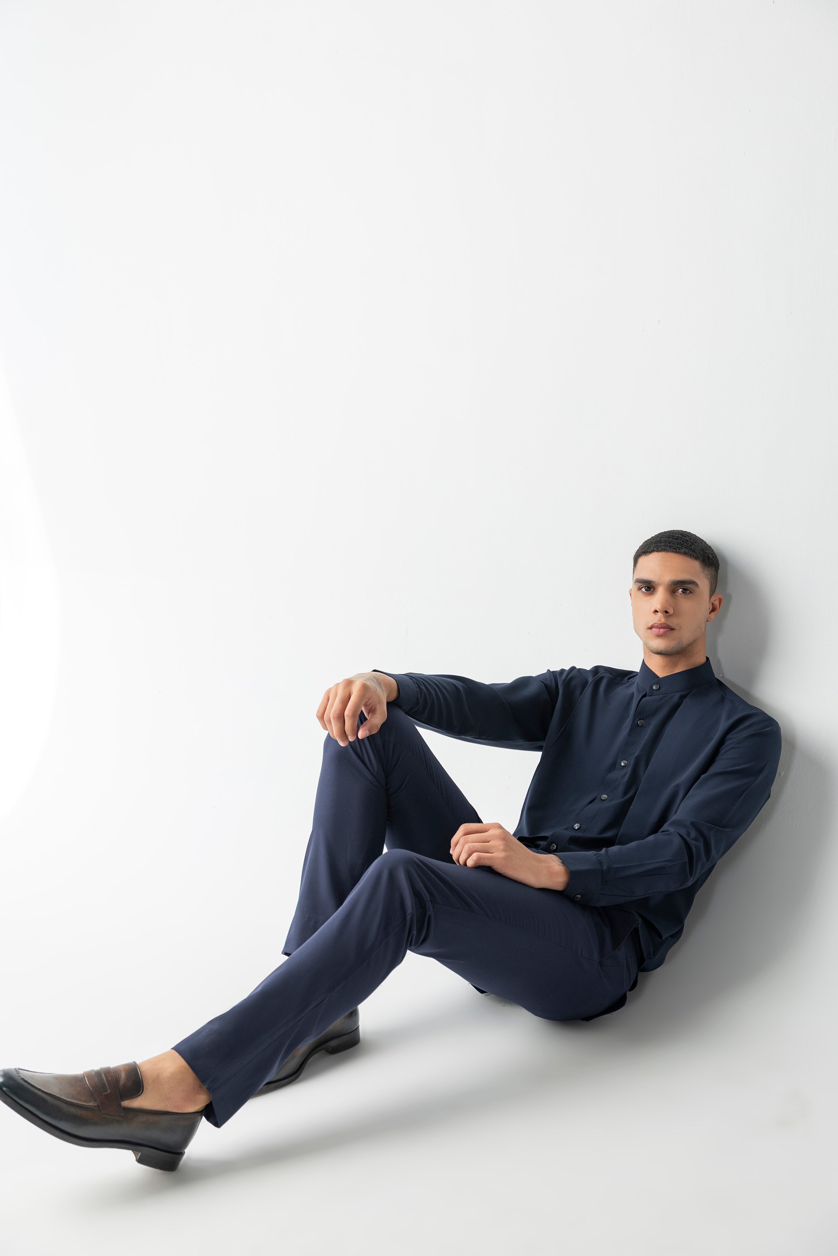 Navy blue shirt with asymmetrical cuts & drapes