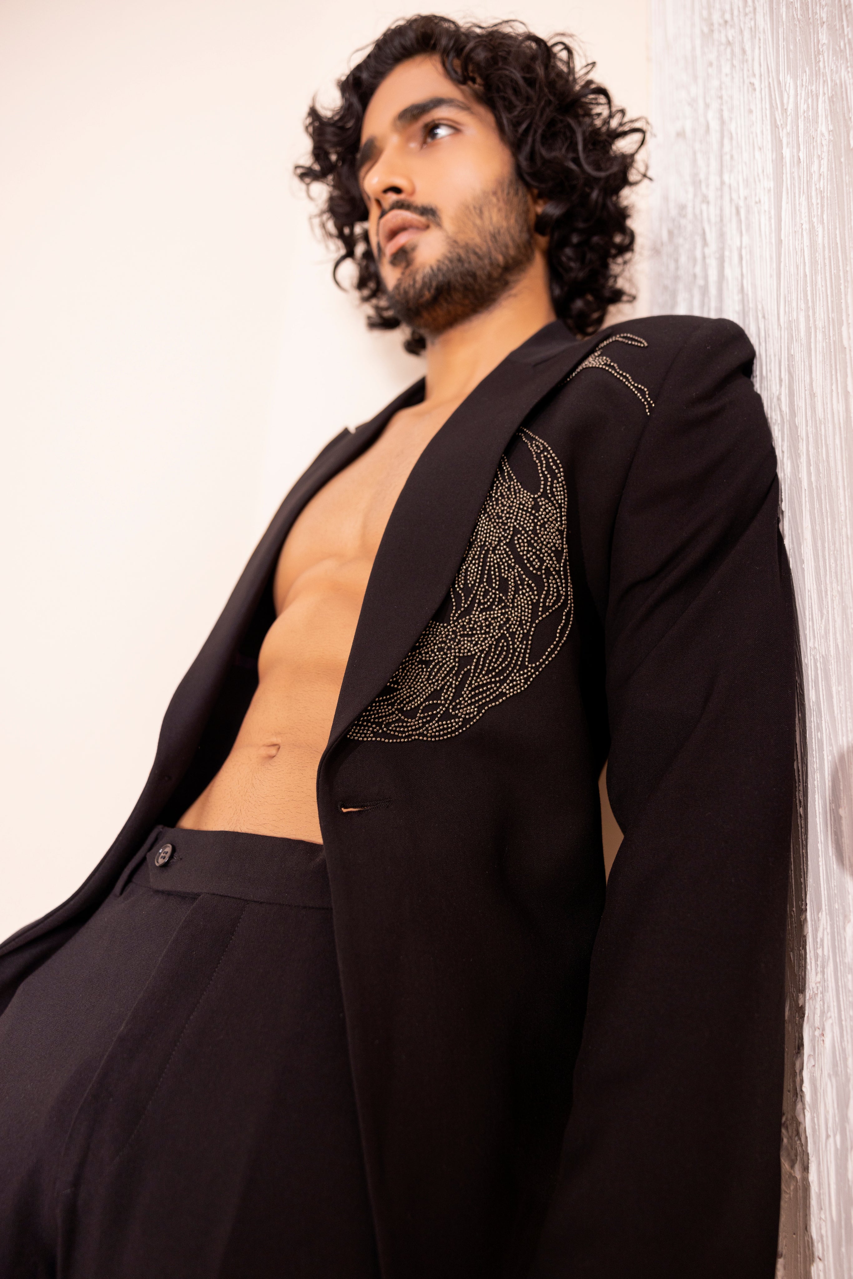 Hand embroidered metal work coat paired with matching pants.