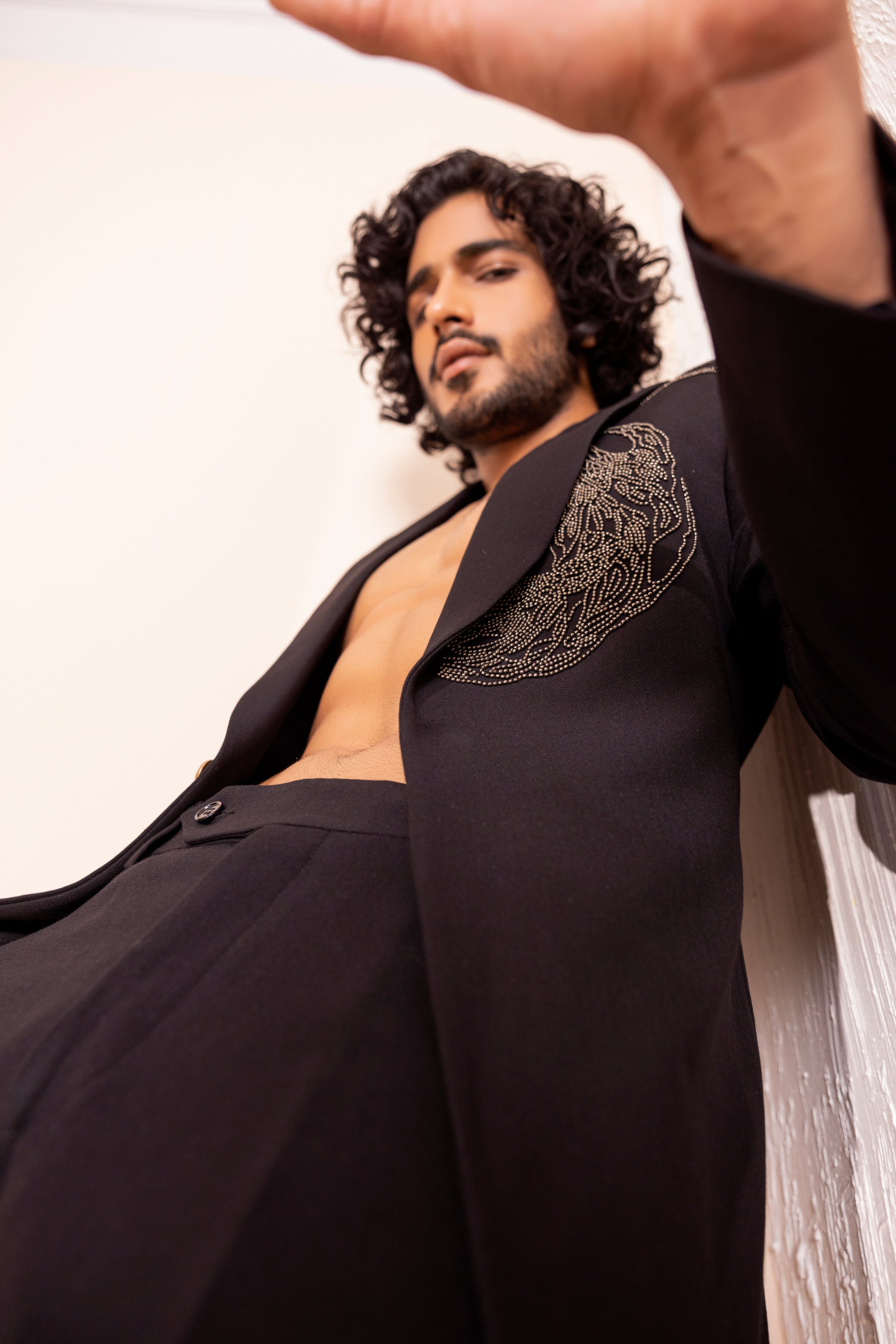 Hand embroidered metal work coat paired with matching pants.
