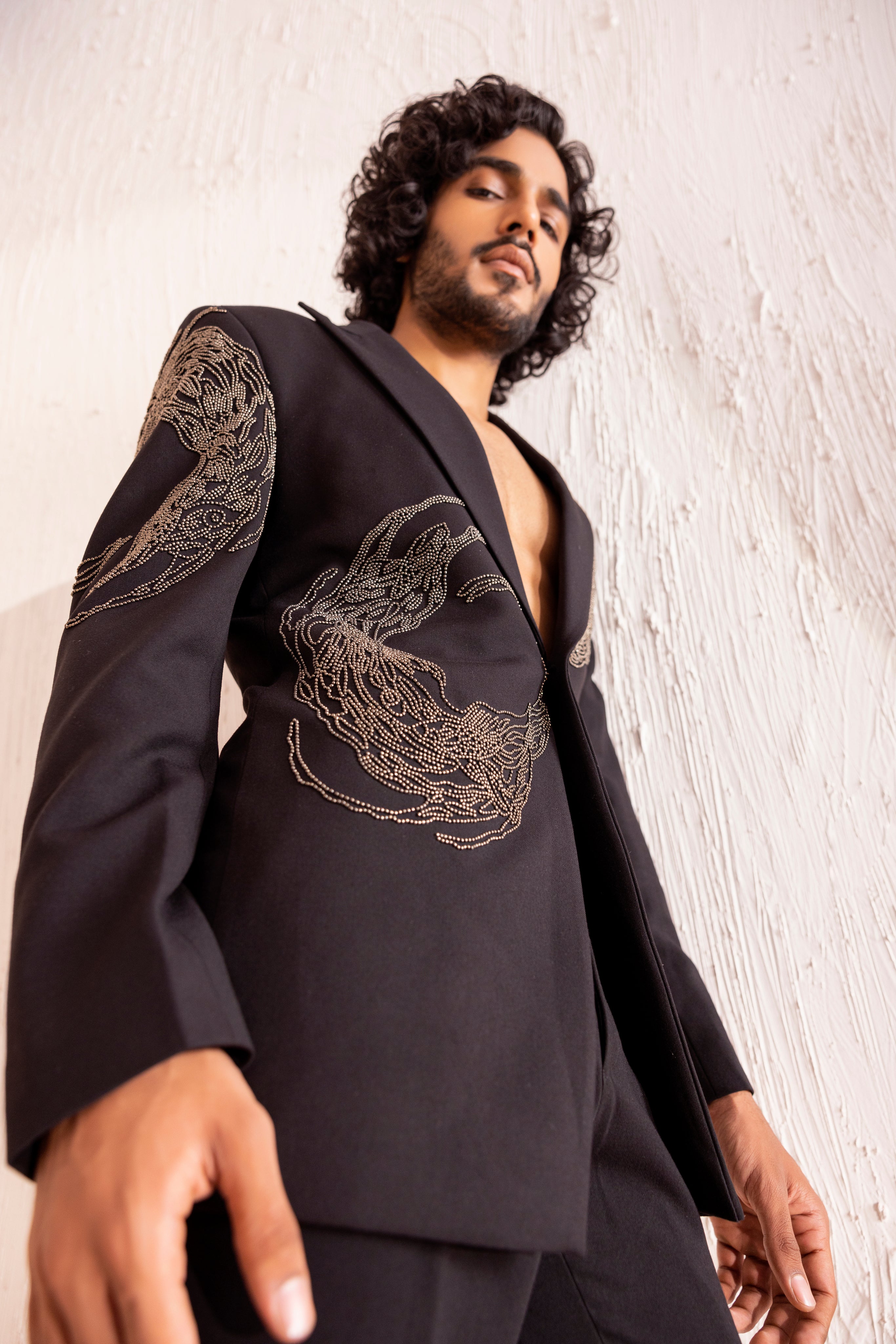 Hand embroidered metal work coat paired with matching pants.