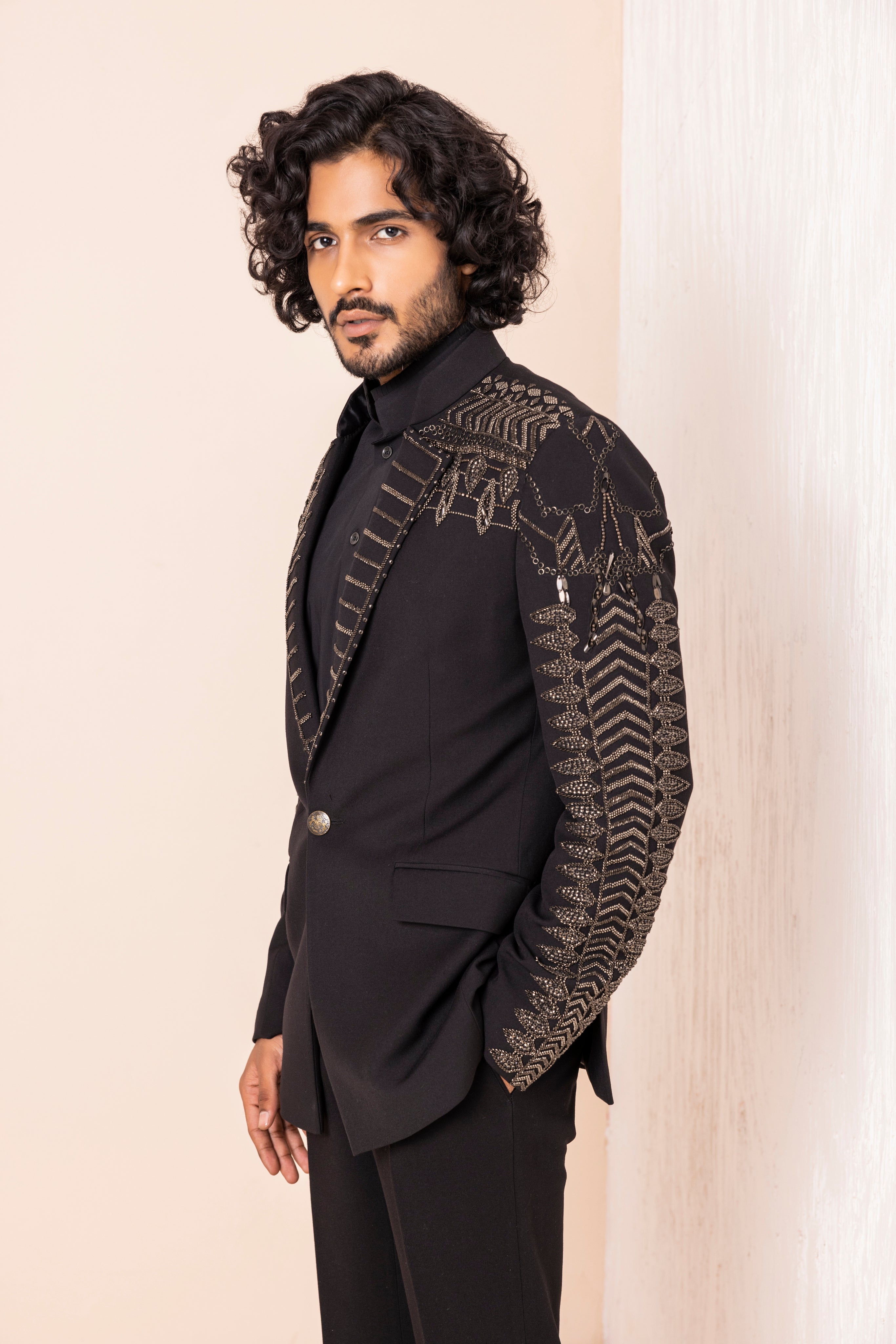 Hand embroidered metal work coat paired with matching pants.