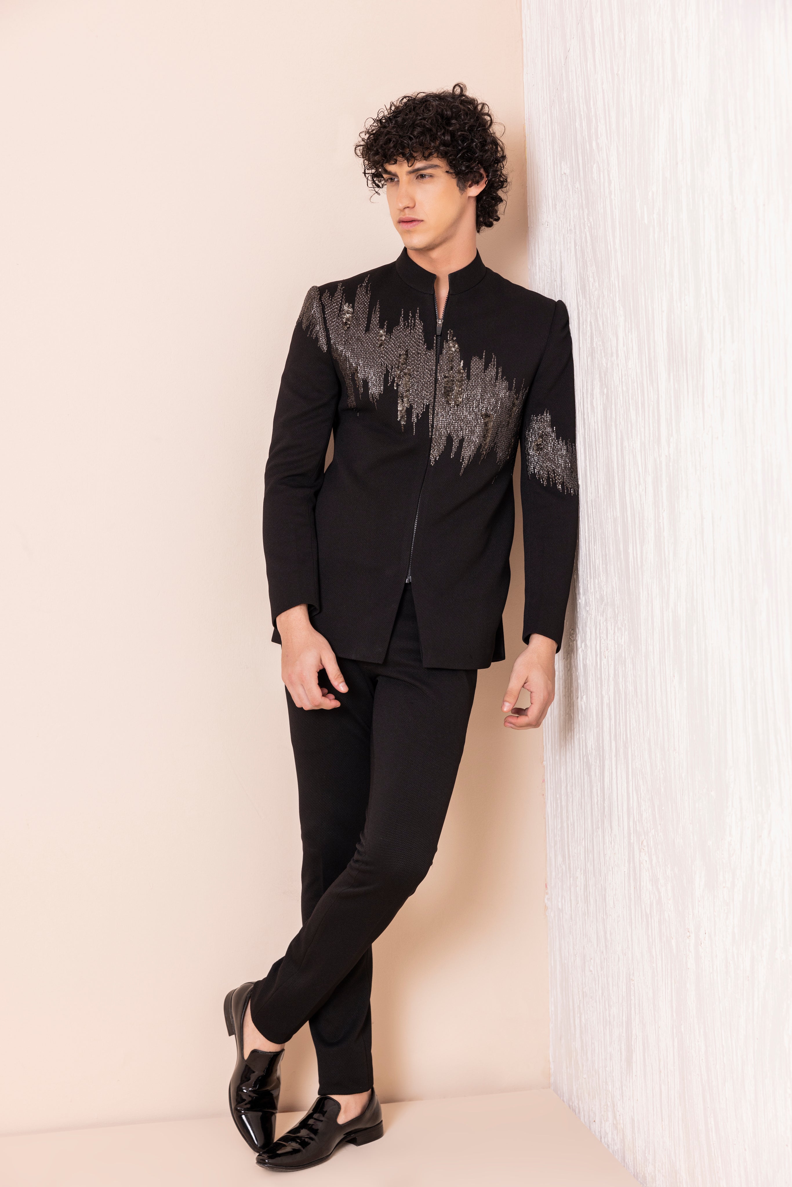 Hand embroidered metal work jodhpuri paired with pants.