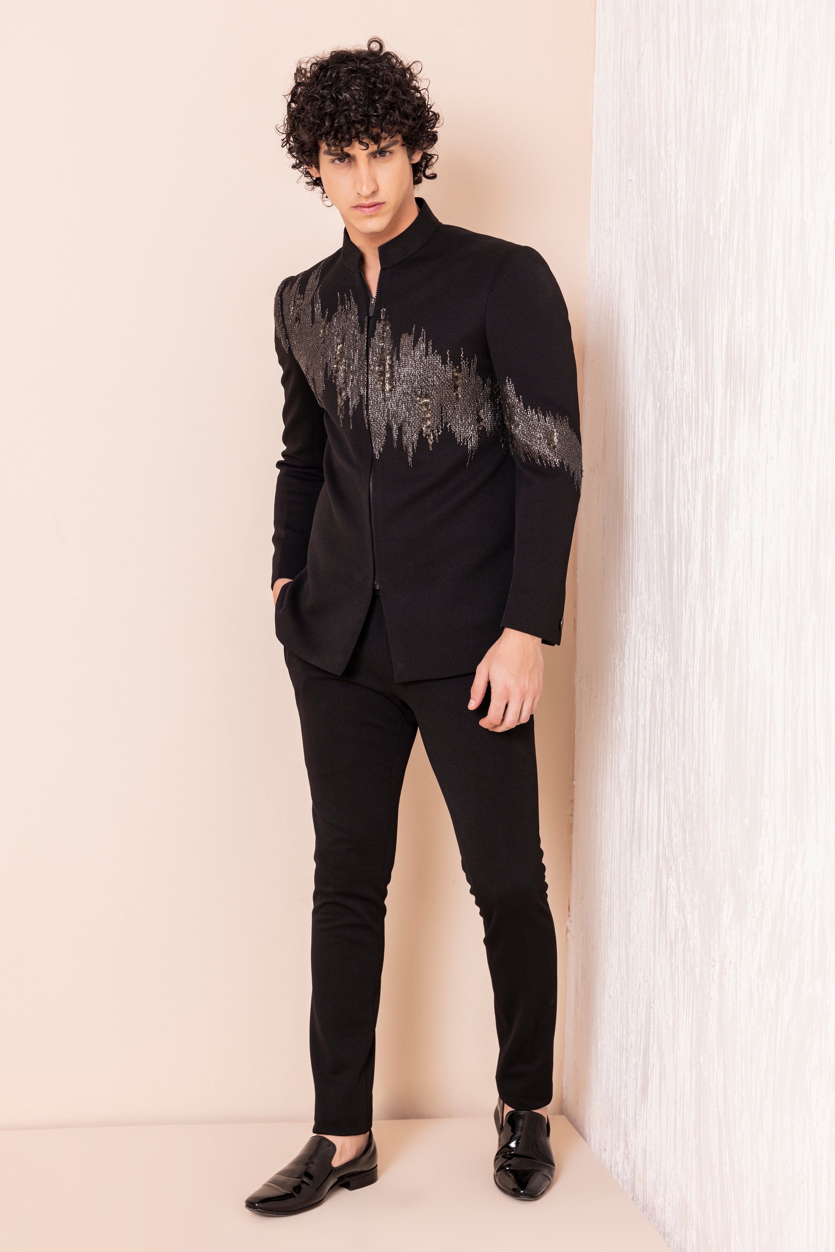 Hand embroidered metal work jodhpuri paired with pants.