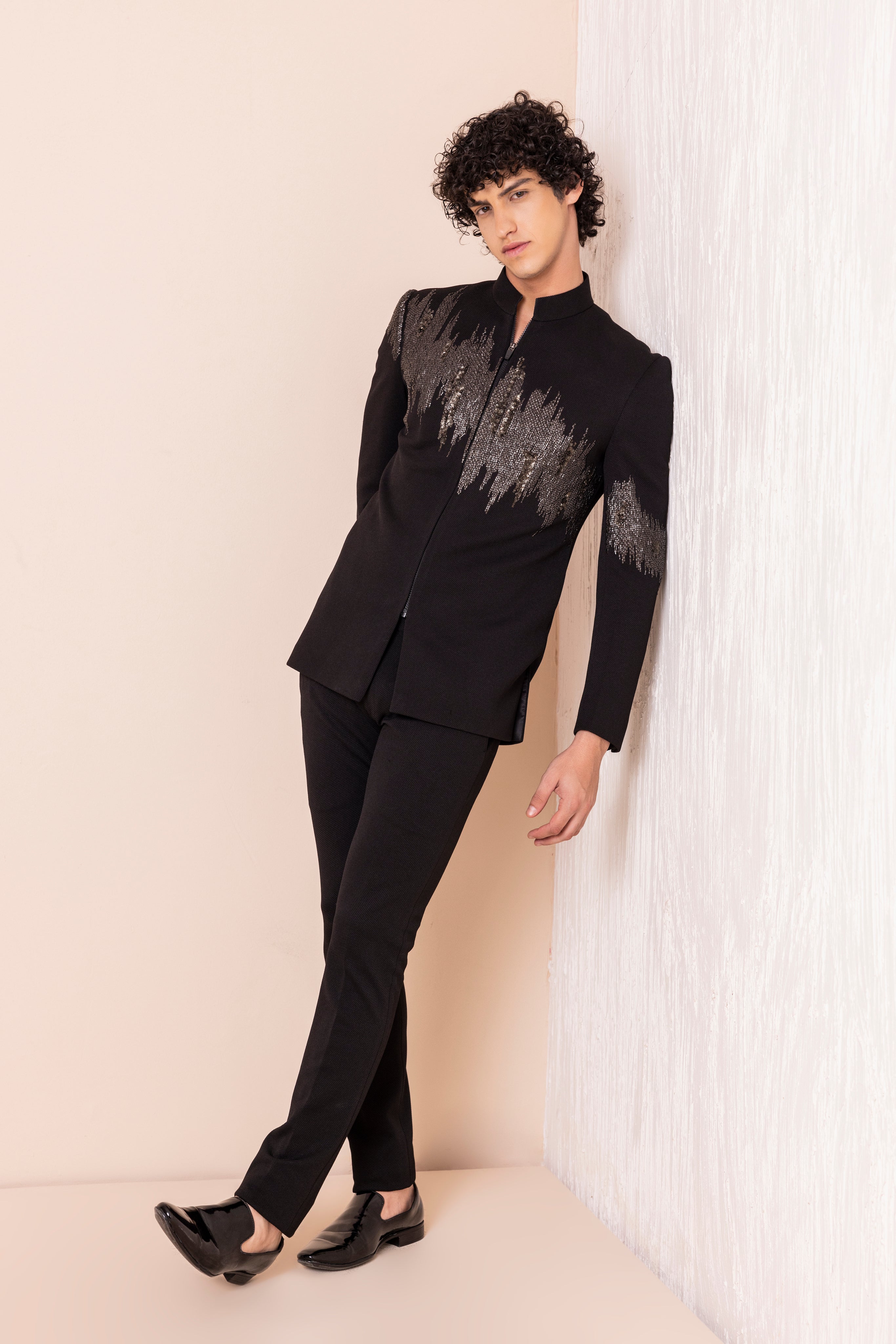 Hand embroidered metal work jodhpuri paired with pants.