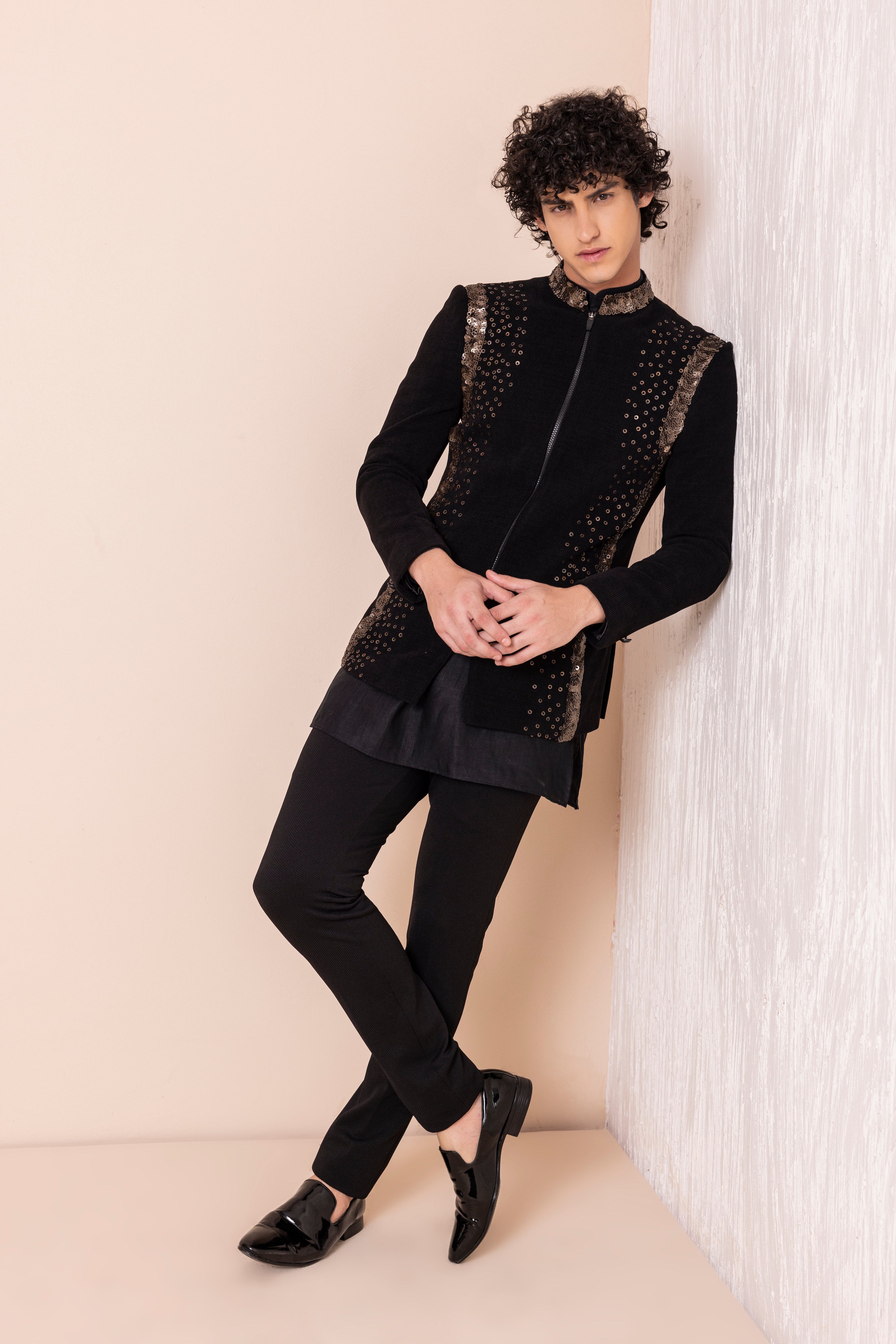 Sequins detailing jodhpuri paired with short kurta and pants.