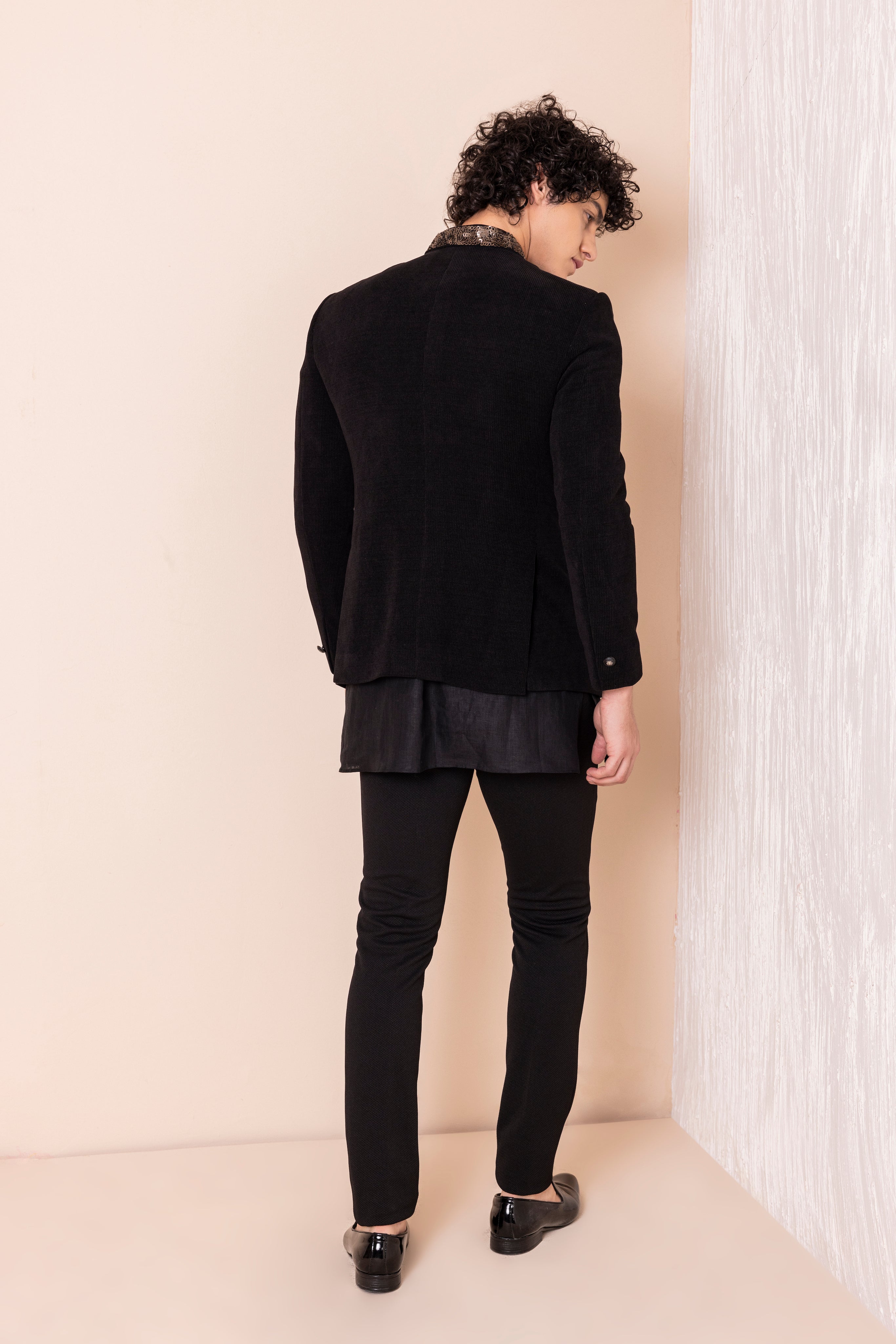 Sequins detailing jodhpuri paired with short kurta and pants.