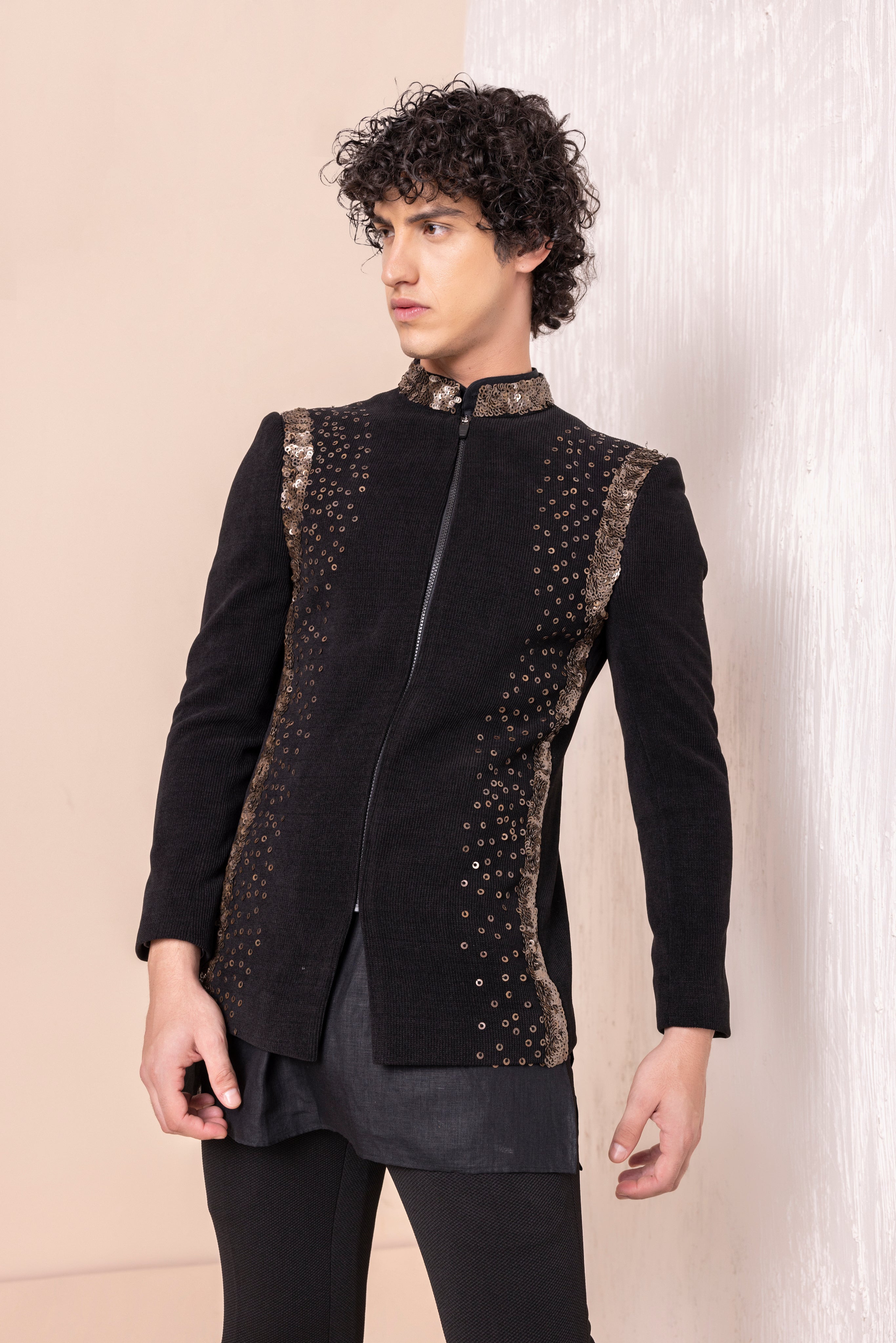 Sequins detailing jodhpuri paired with short kurta and pants.
