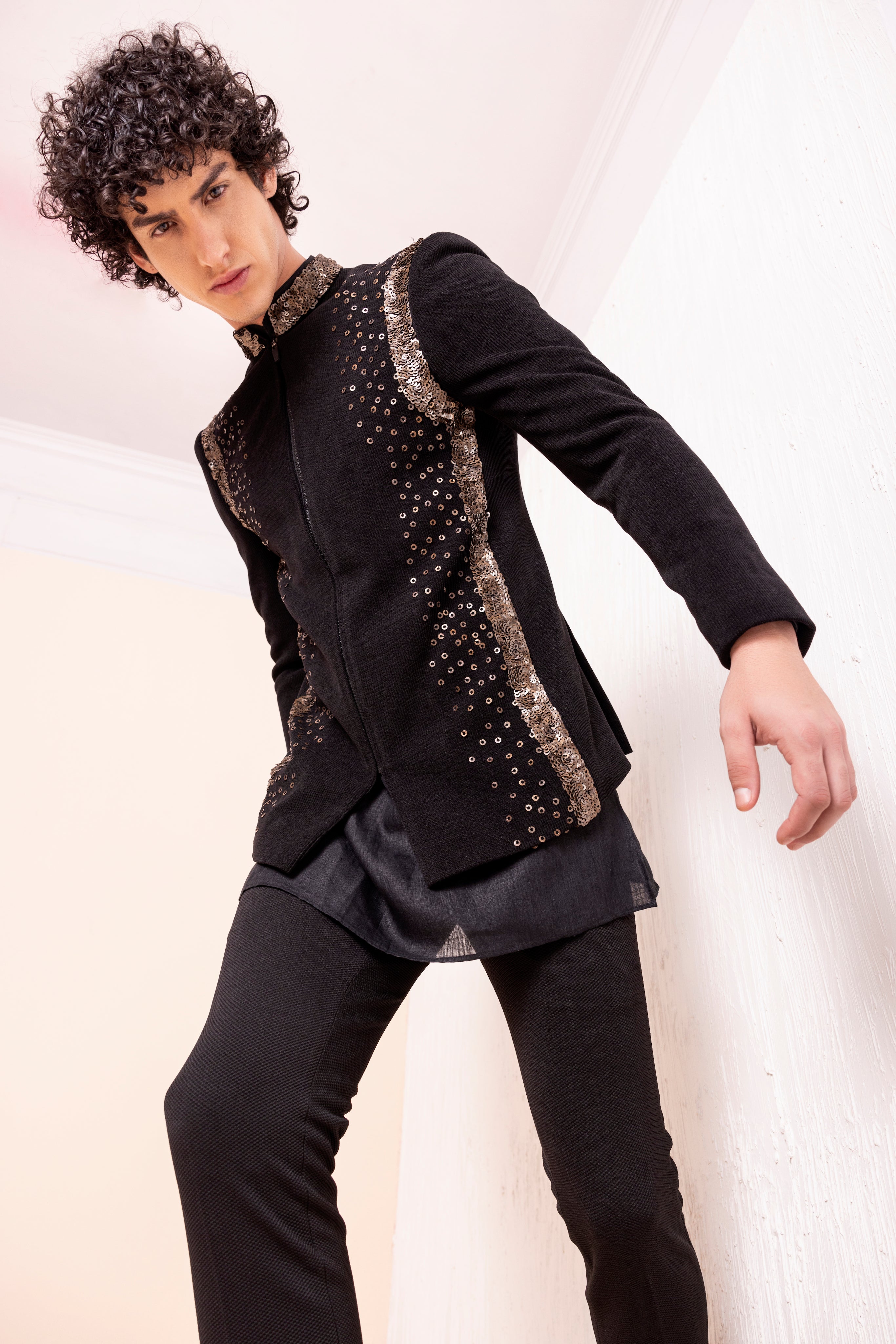 Sequins detailing jodhpuri paired with short kurta and pants.