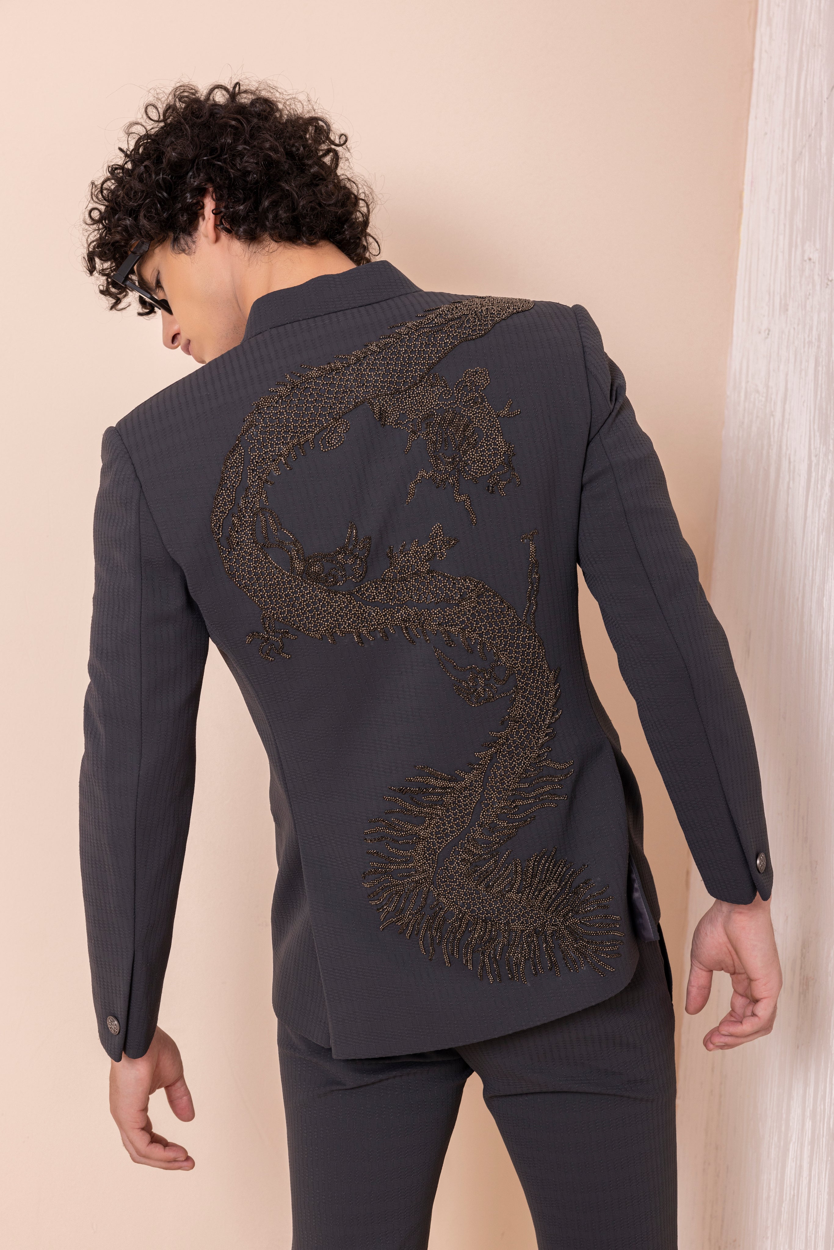 Hand embroidered Dragon motif jacket paired with matching pants.