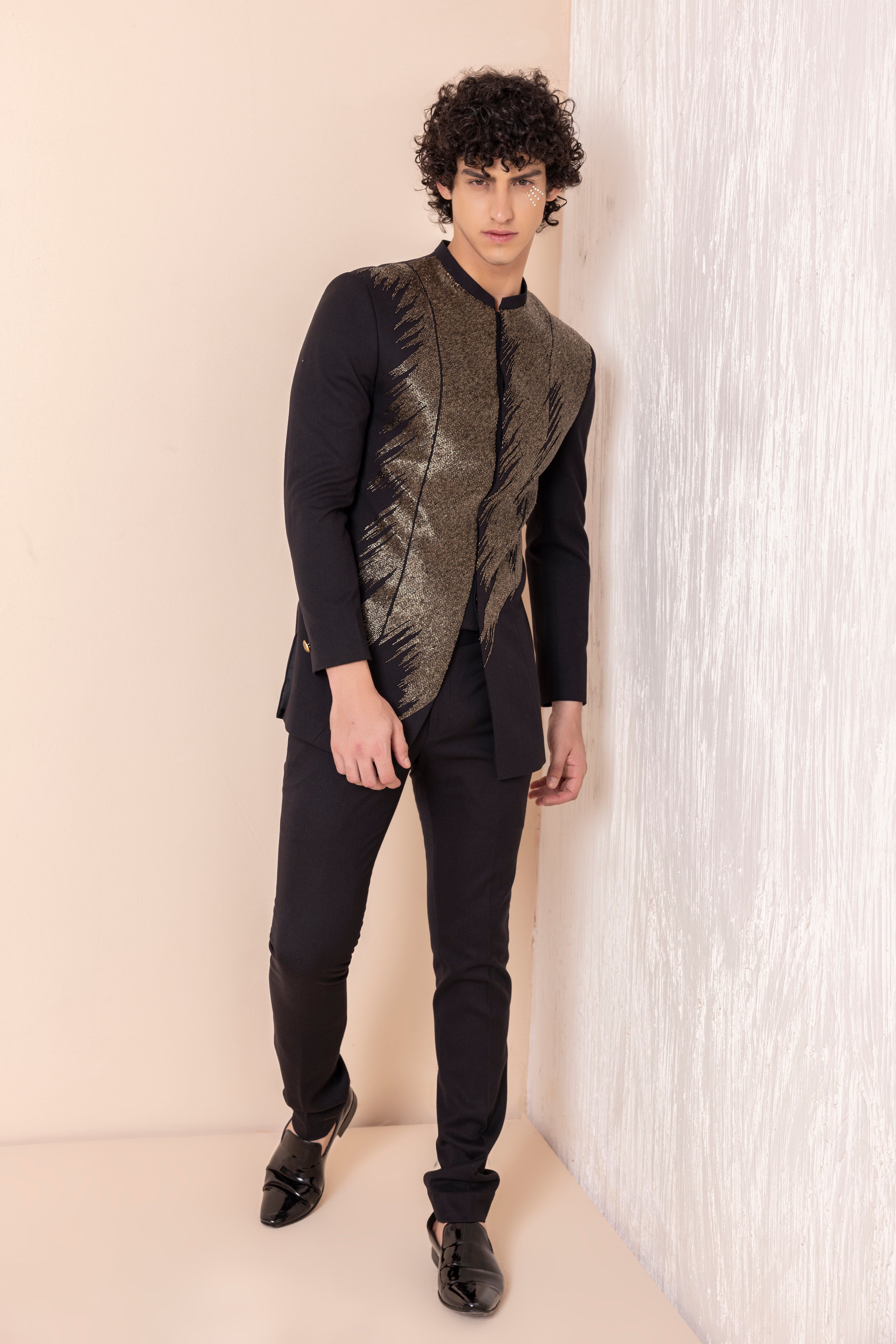 Hand embroidered metal work coat paired with matching pants.