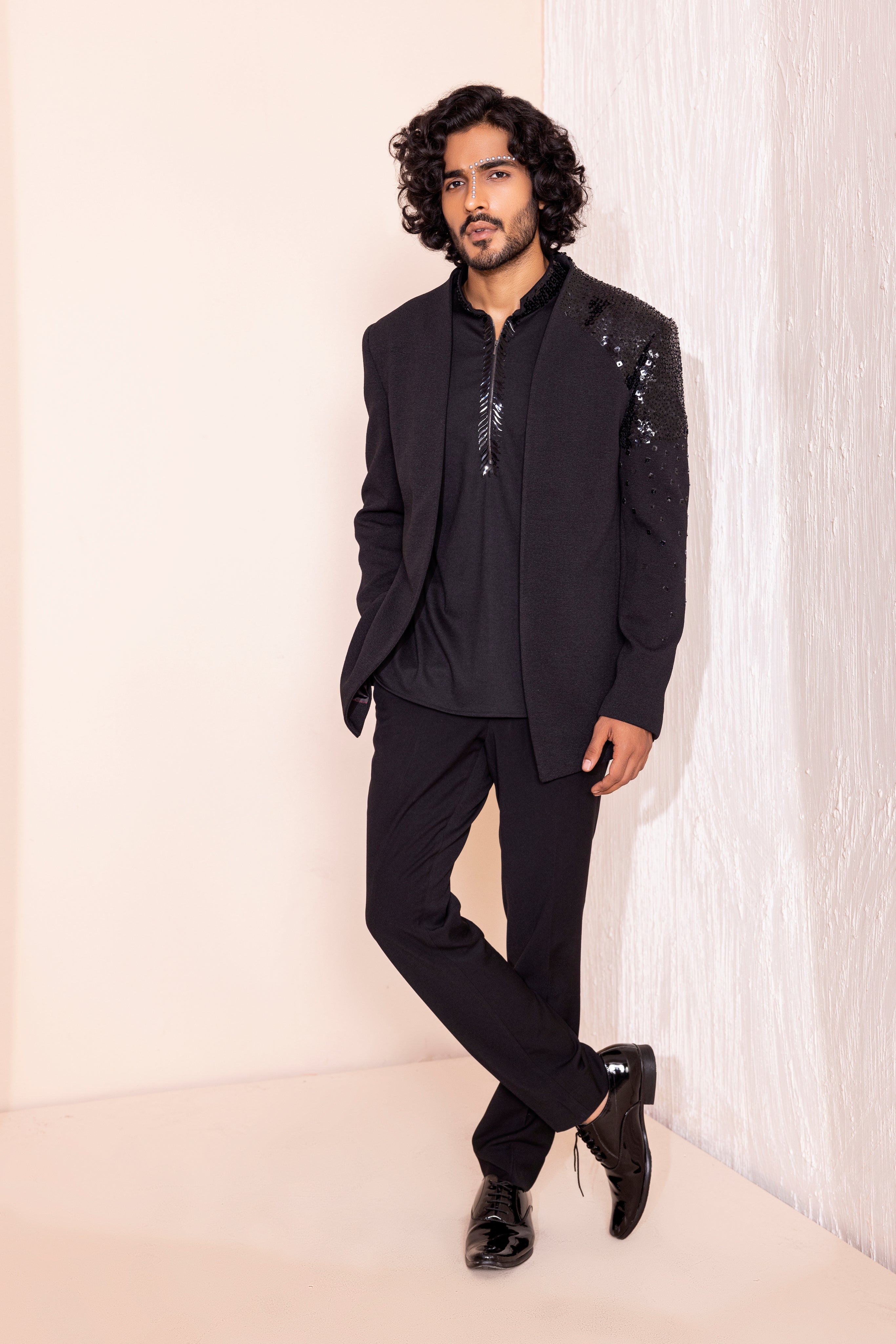 Hand embroidered detailing coat paired with kurta and pants.