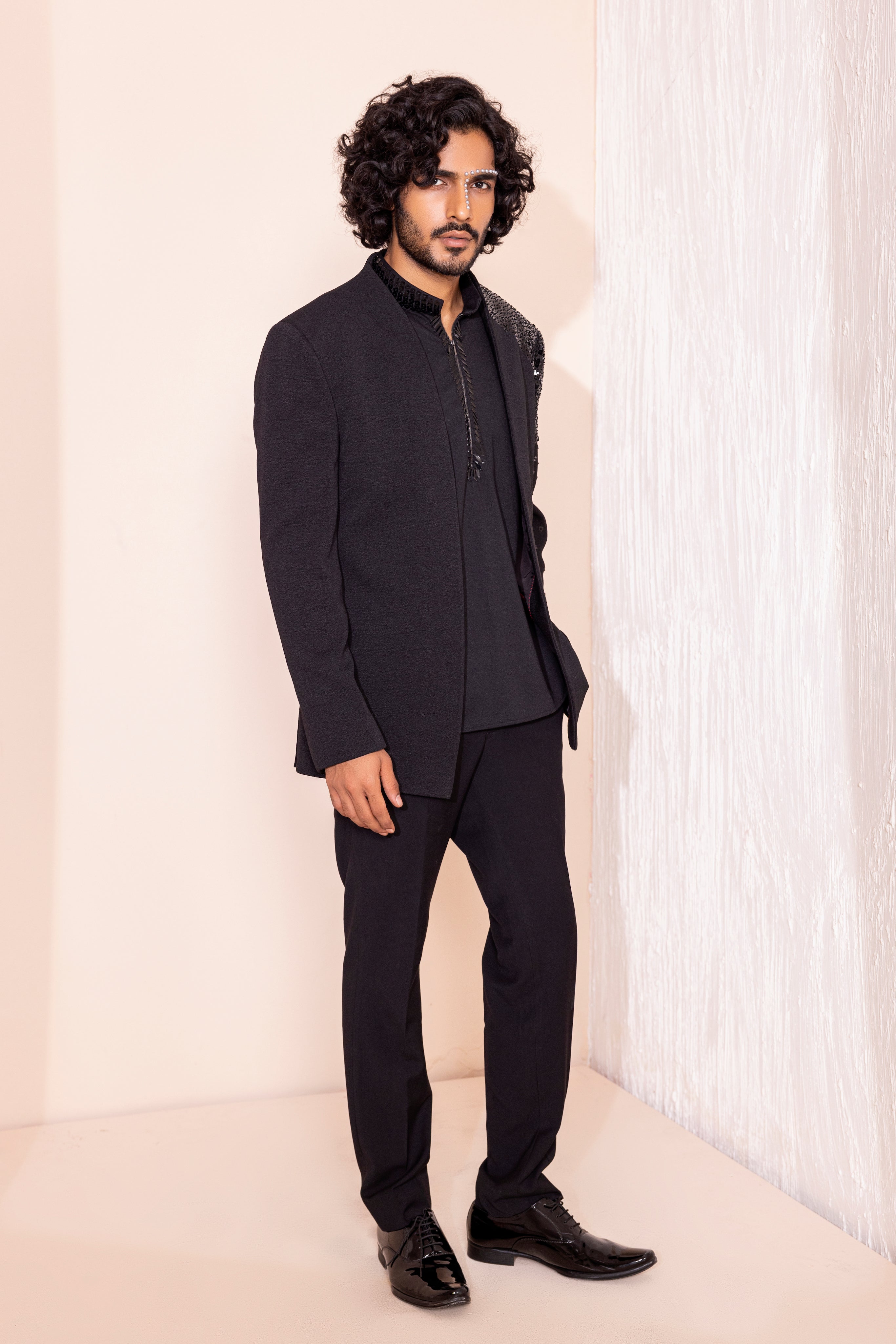 Hand embroidered detailing coat paired with kurta and pants.