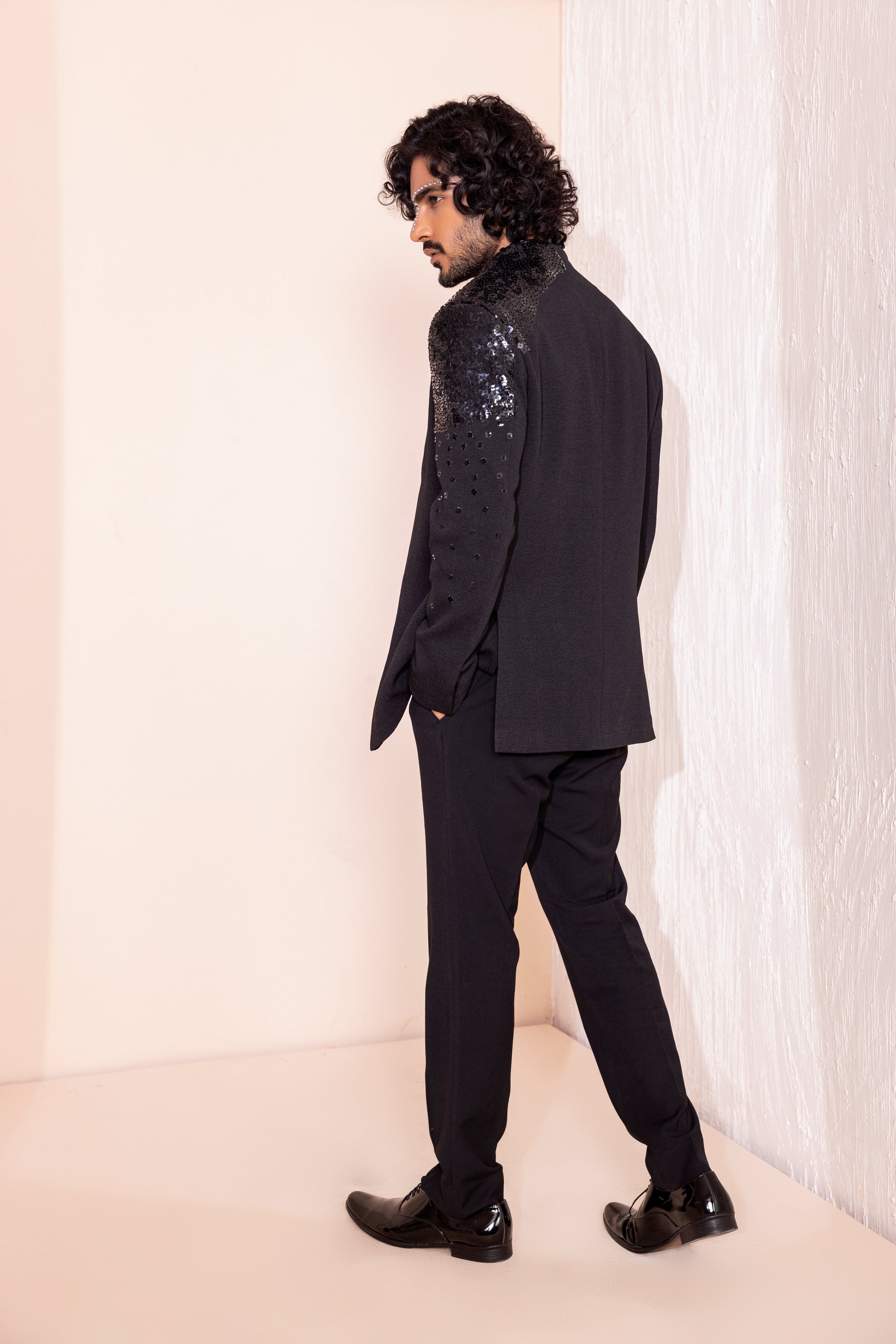Hand embroidered detailing coat paired with kurta and pants.