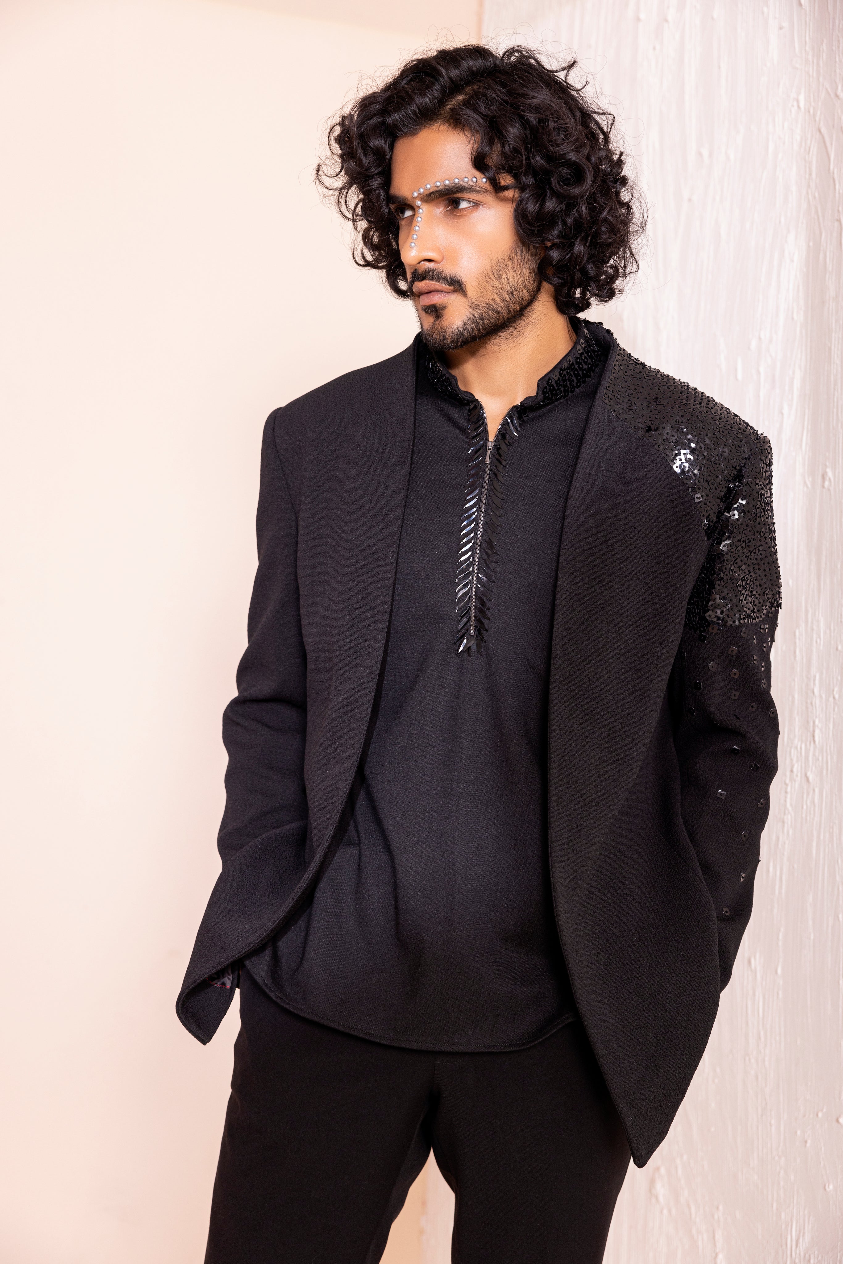 Hand embroidered detailing coat paired with kurta and pants.