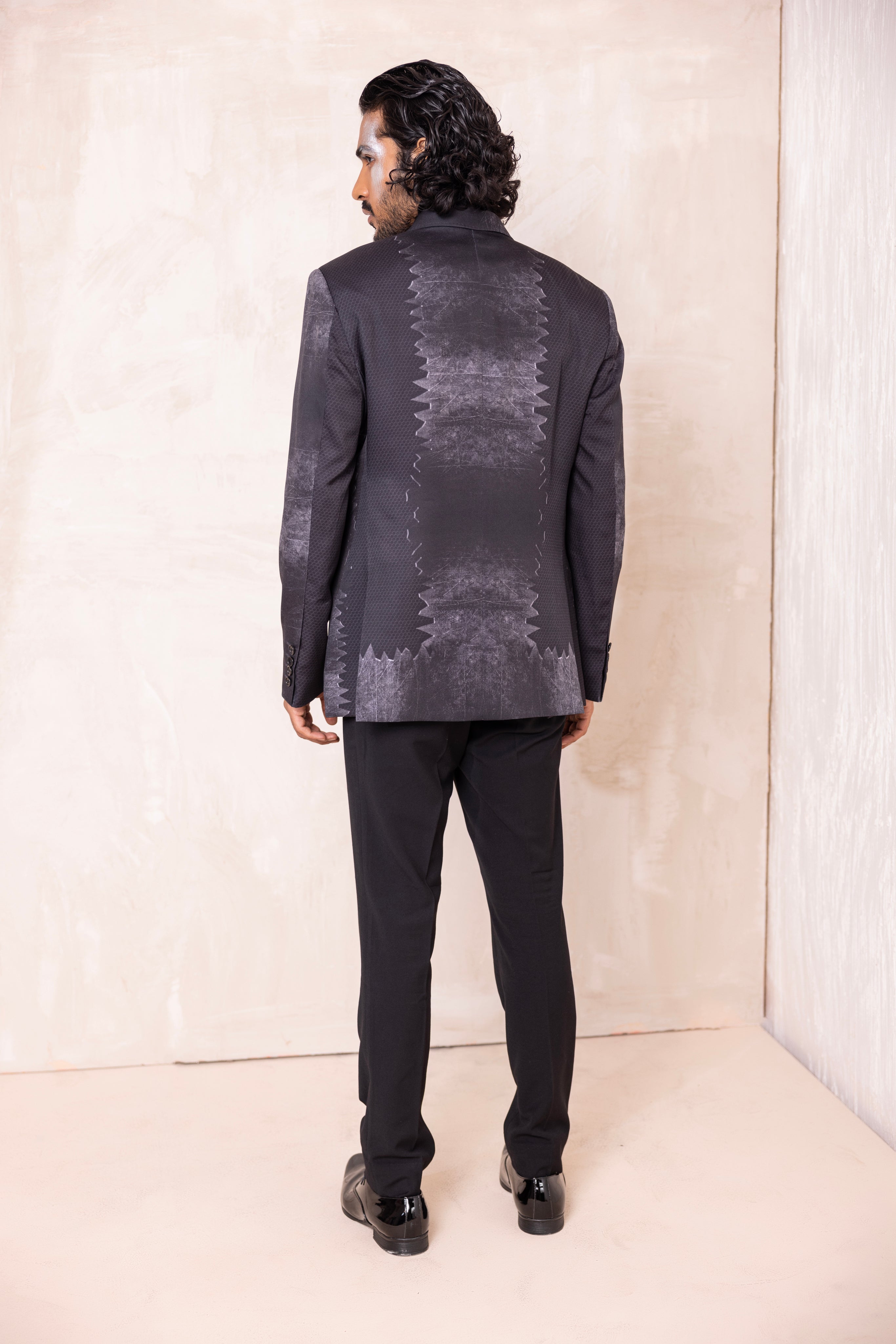 Digital print blazer with abstract design.