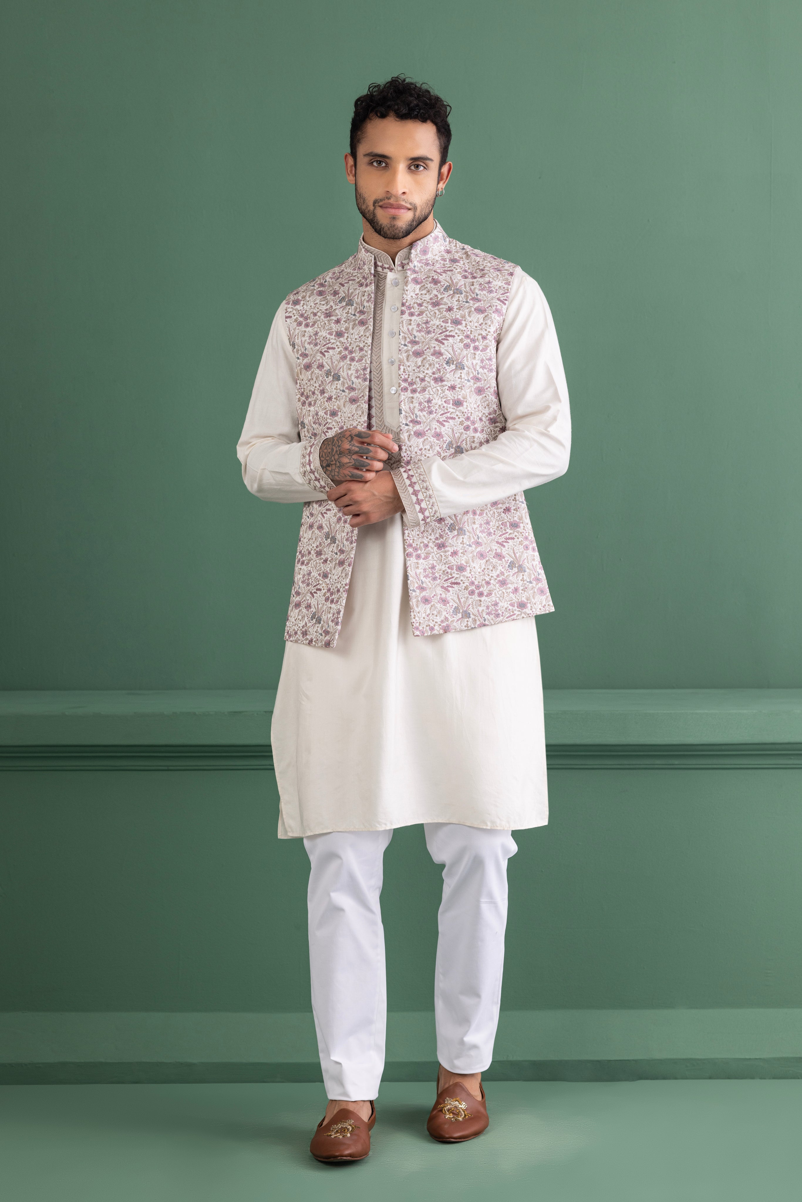Purple waistcoat with floral embroidery paired with a matching kurta and off-white aligadhi