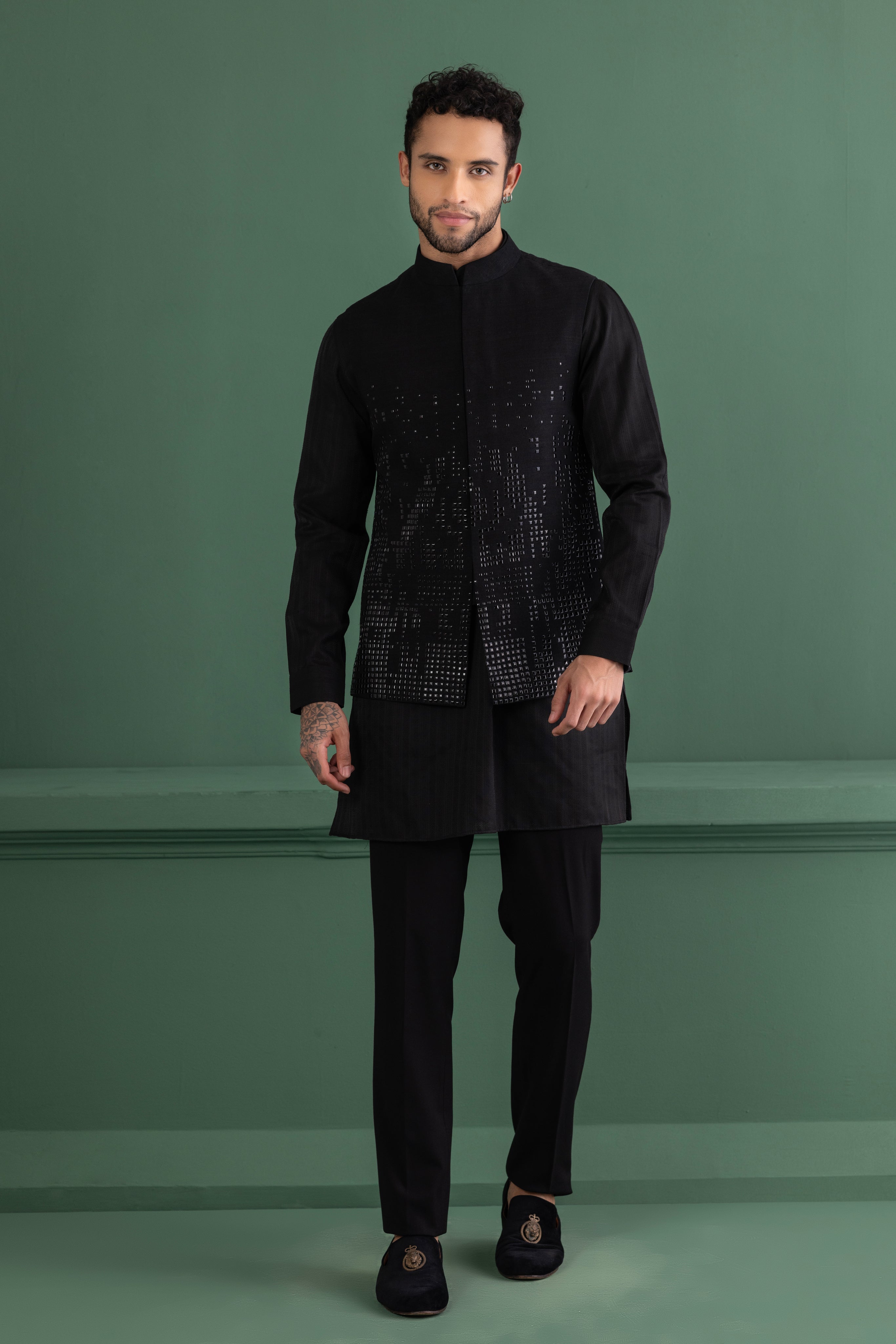 Black waistcoat with metal wotk paired with a matching kurta and aligadhi set