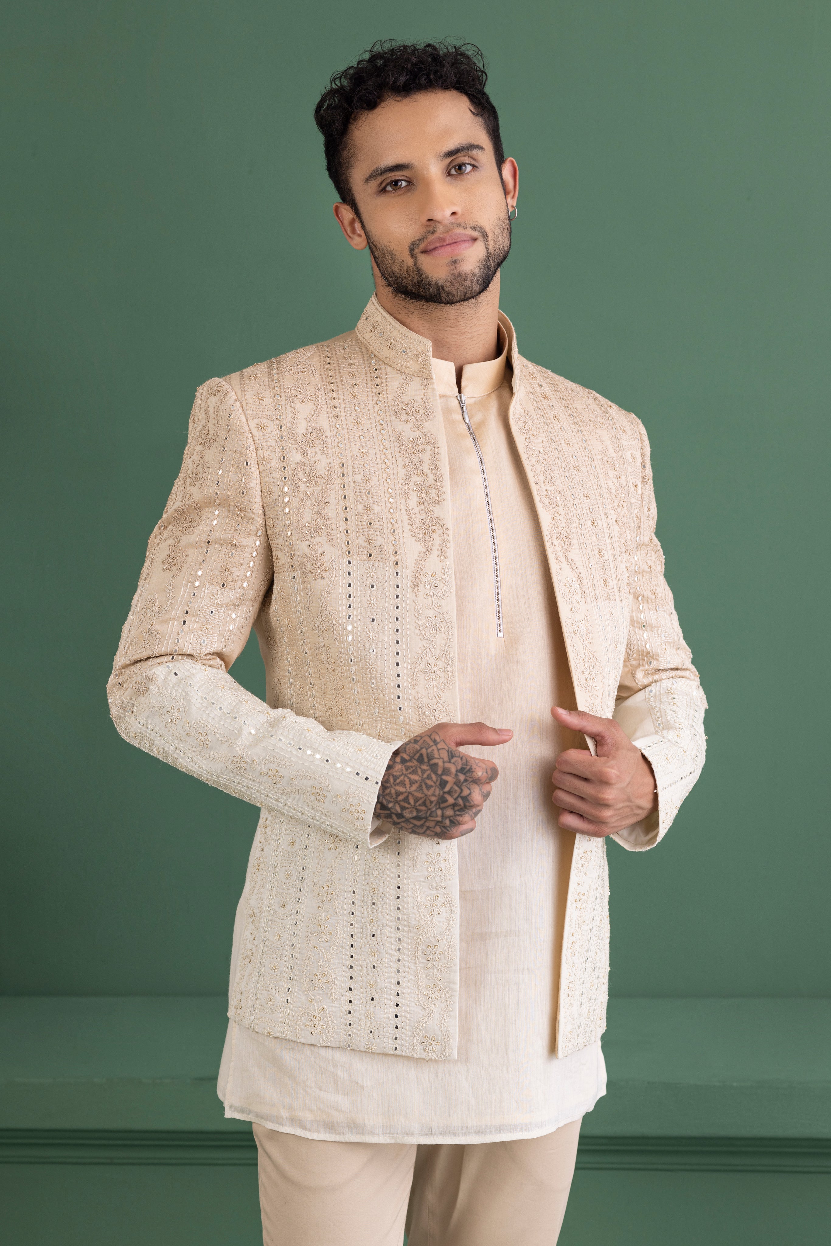 Biege shade open indowestern jacket with mirror work paired with a matching kurta and beige pants