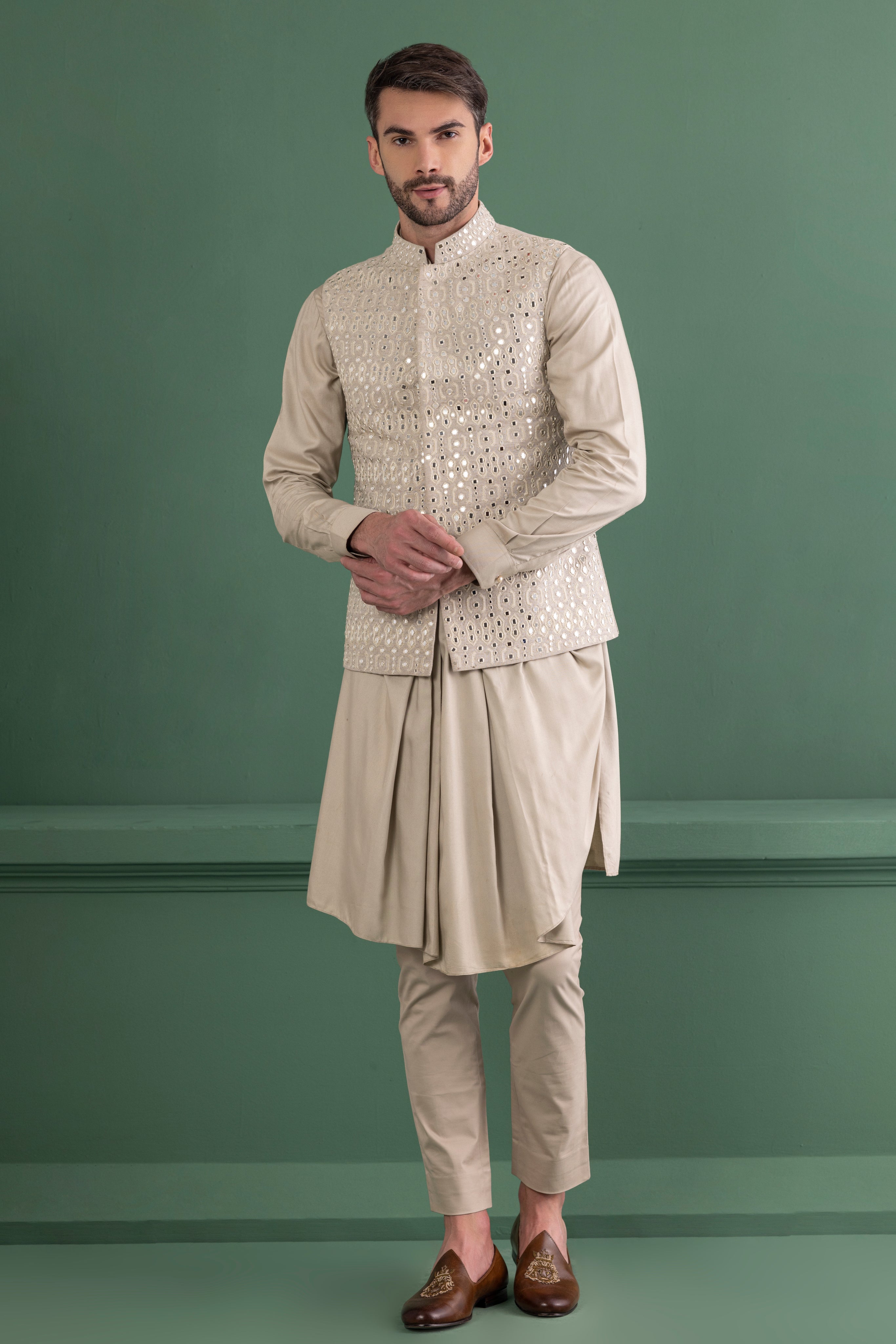 Light olive mirror work waistcoat paired with a cowl kurta and beige aligadhi