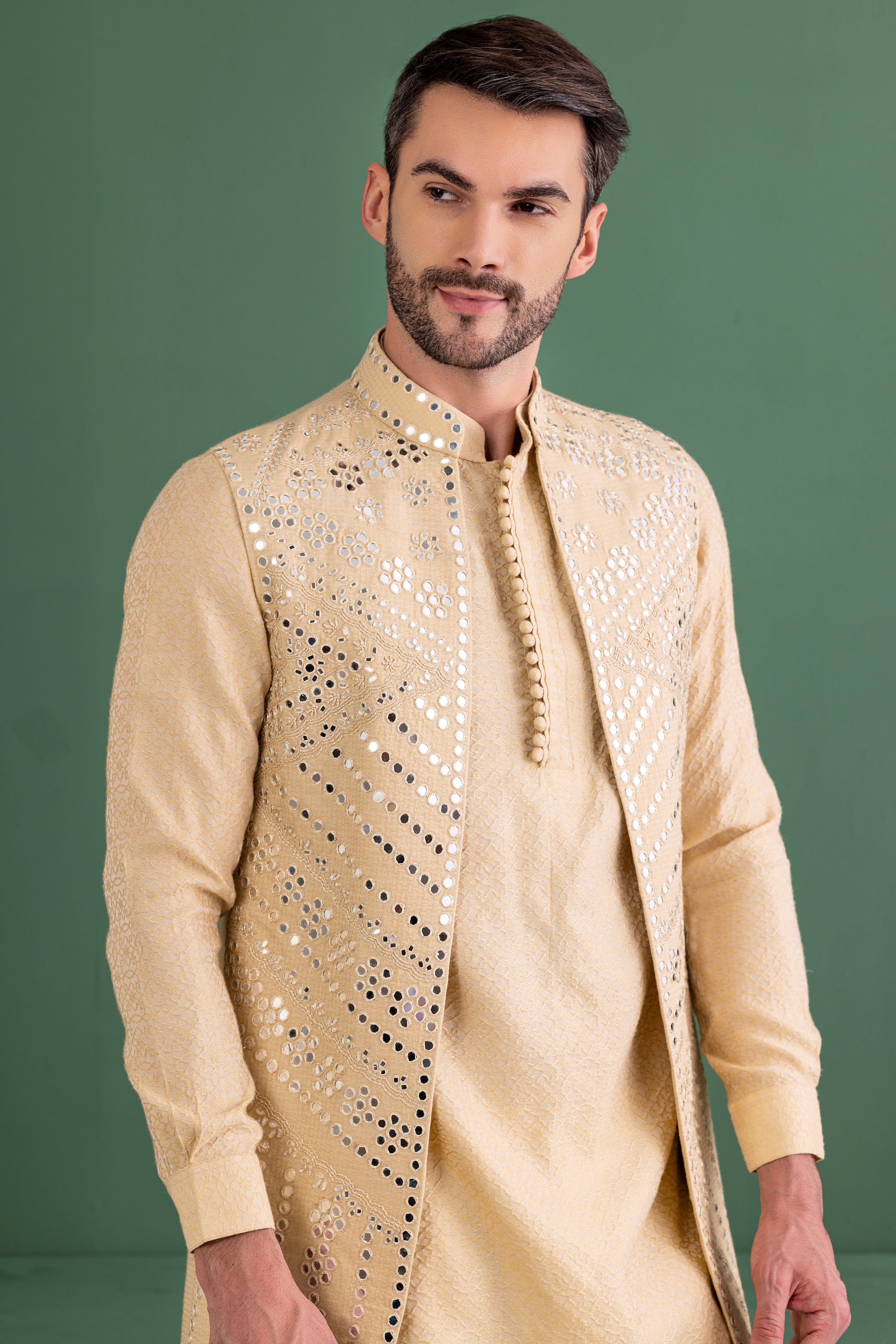 Gold waistcoat with mirror wotk paired with matching kurta and aligadhi set