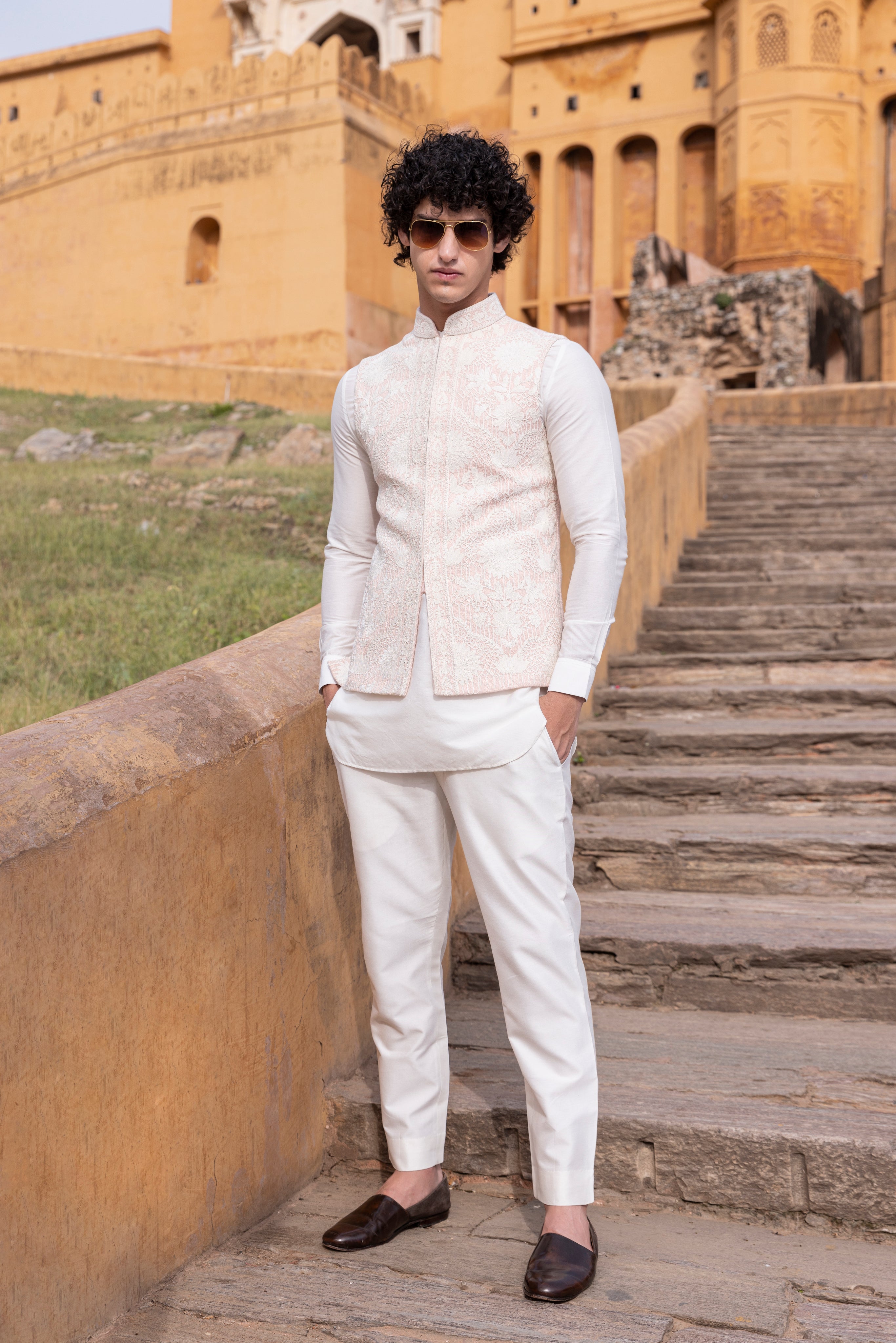 White kiran dori hand embroidery  waistcoat paired with kurta and aligadhi.