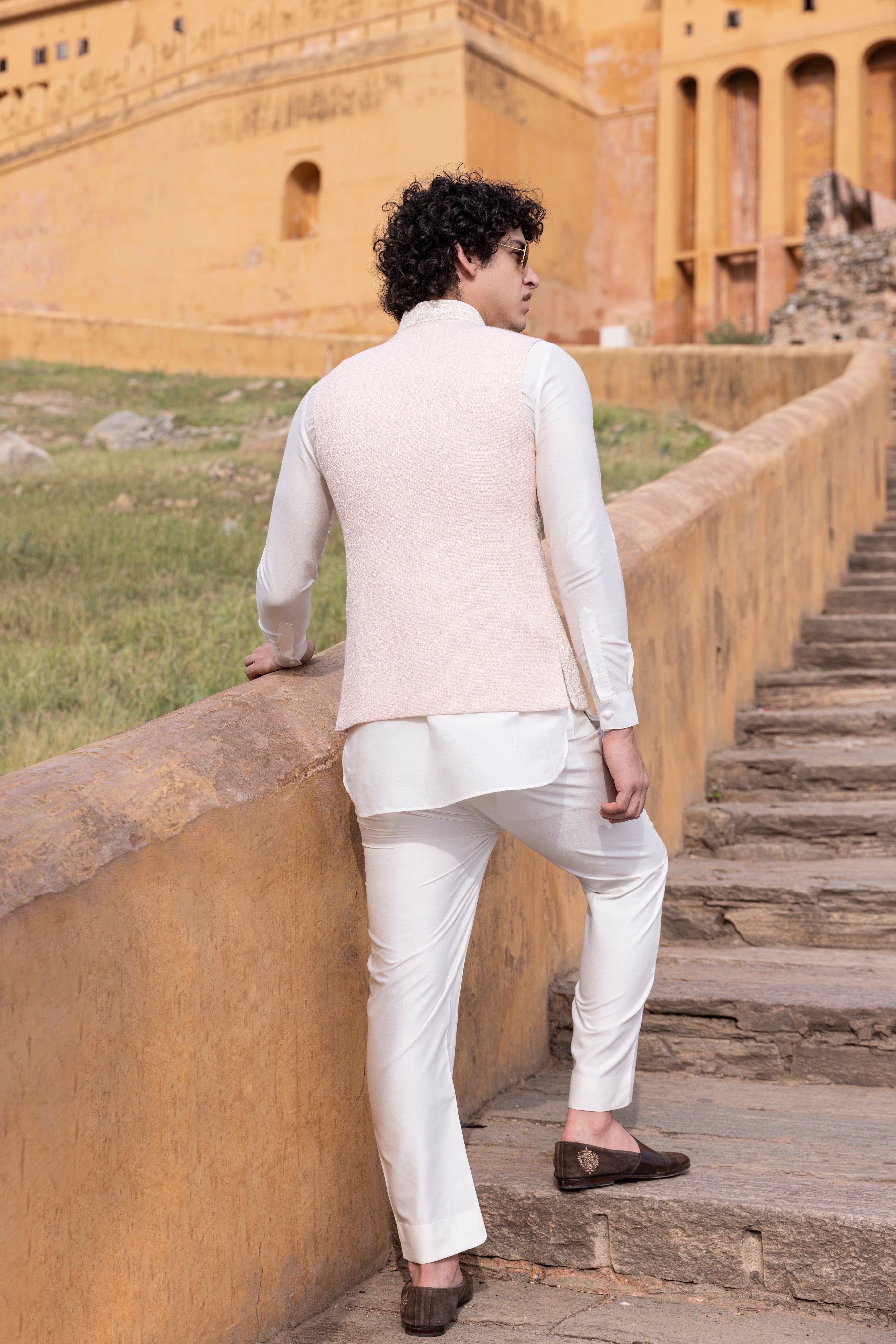 White kiran dori hand embroidery  waistcoat paired with kurta and aligadhi.