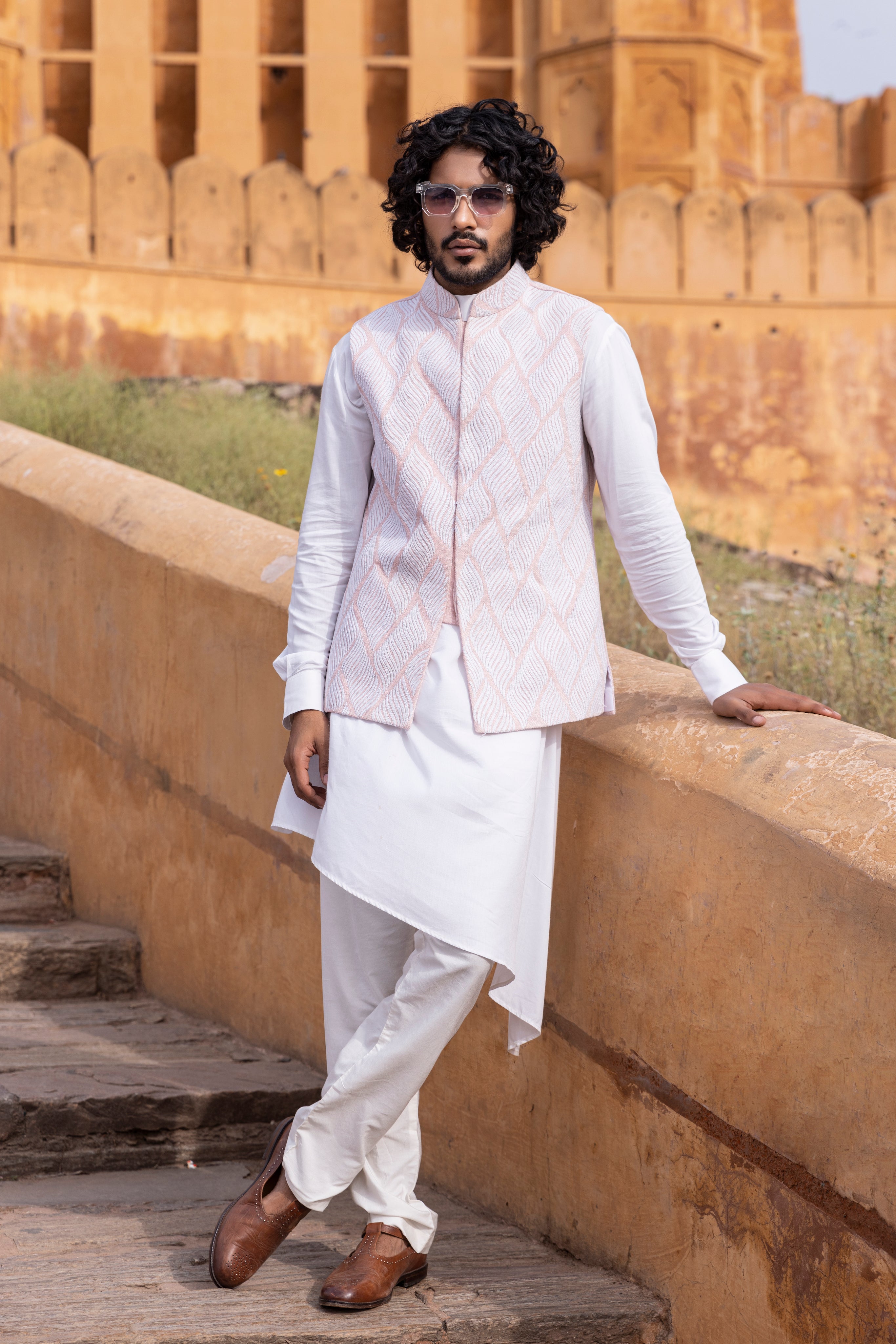 White kiran dori hand embroidery  waistcoat paired with kurta and aligadhi.