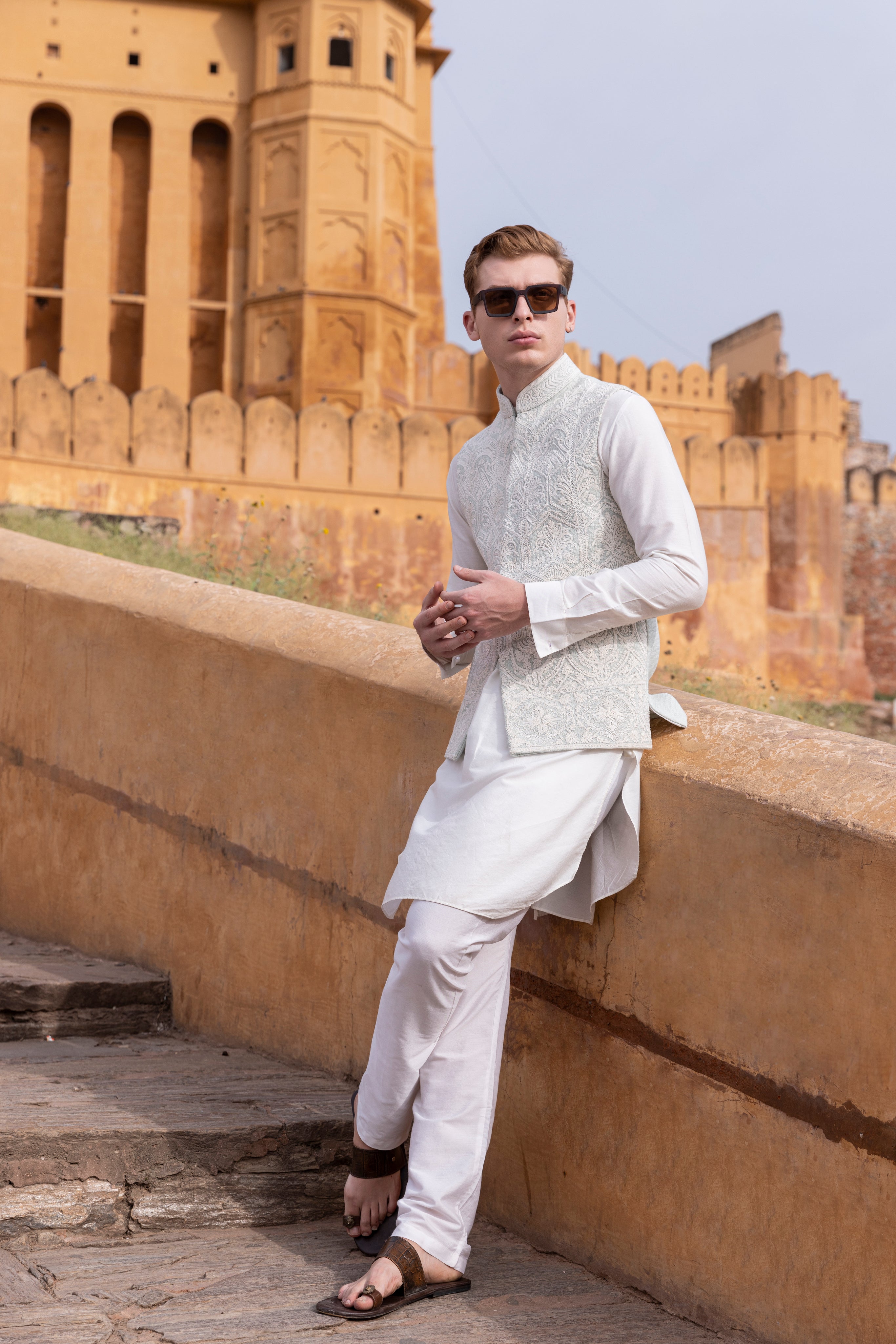 White kiran dori hand embroidery  waistcoat paired with kurta and aligadhi.