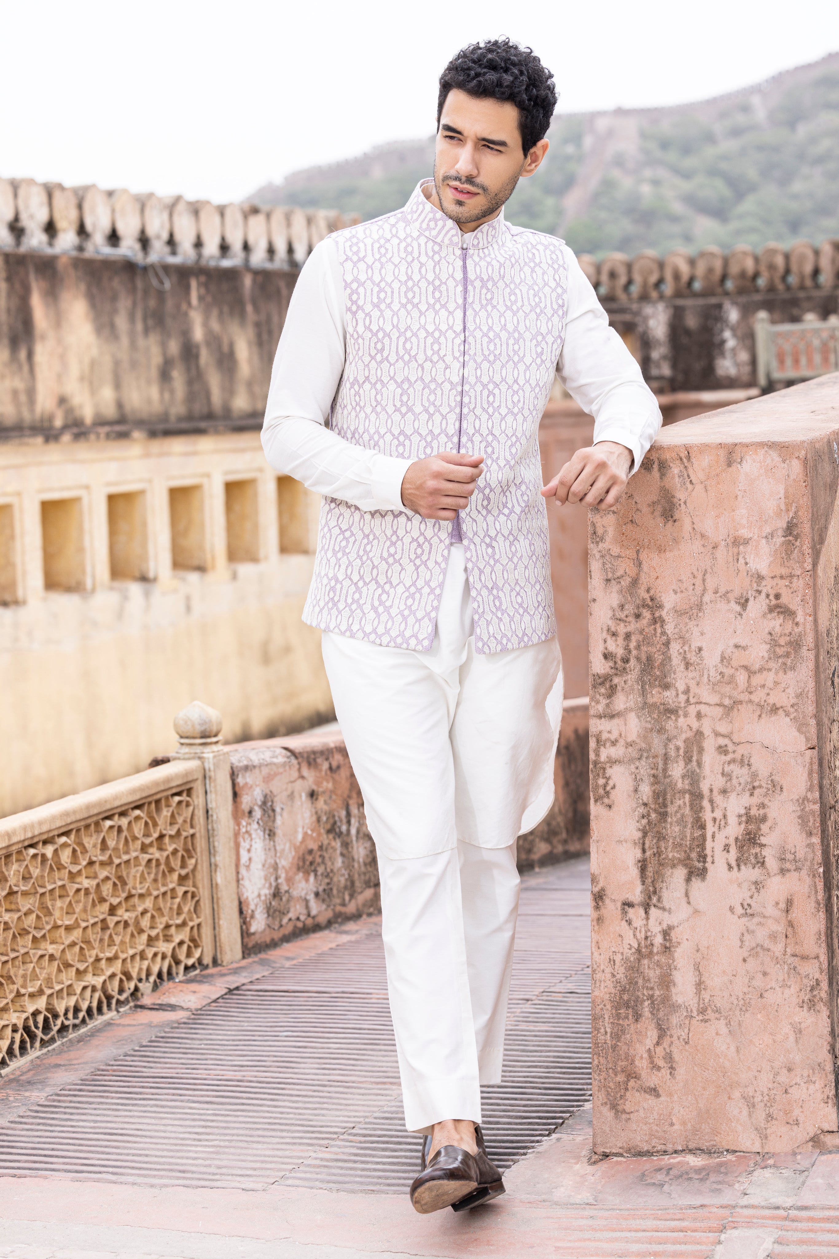 White kiran dori hand embroidery  waistcoat paired with kurta and aligadhi.