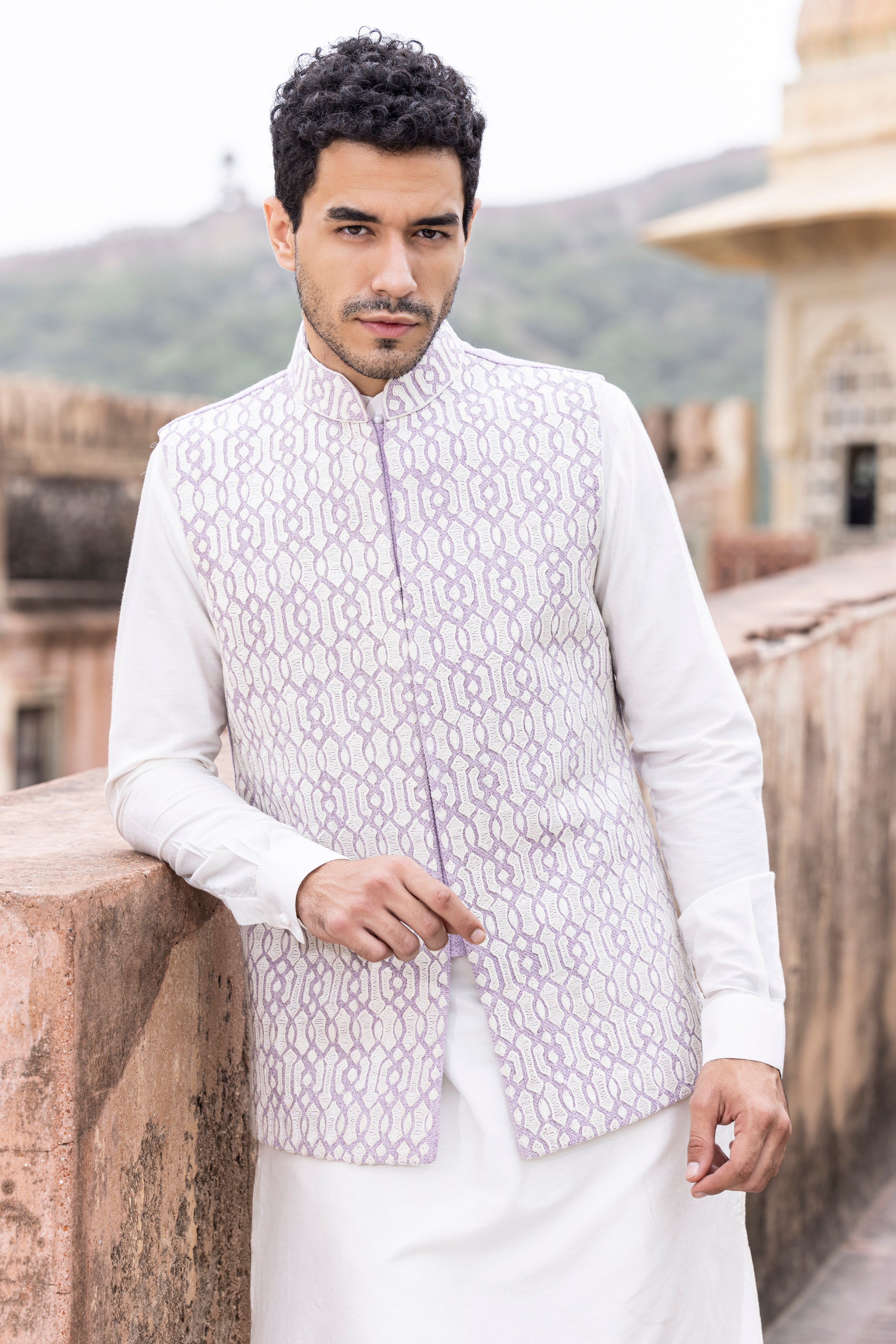 White kiran dori hand embroidery  waistcoat paired with kurta and aligadhi.