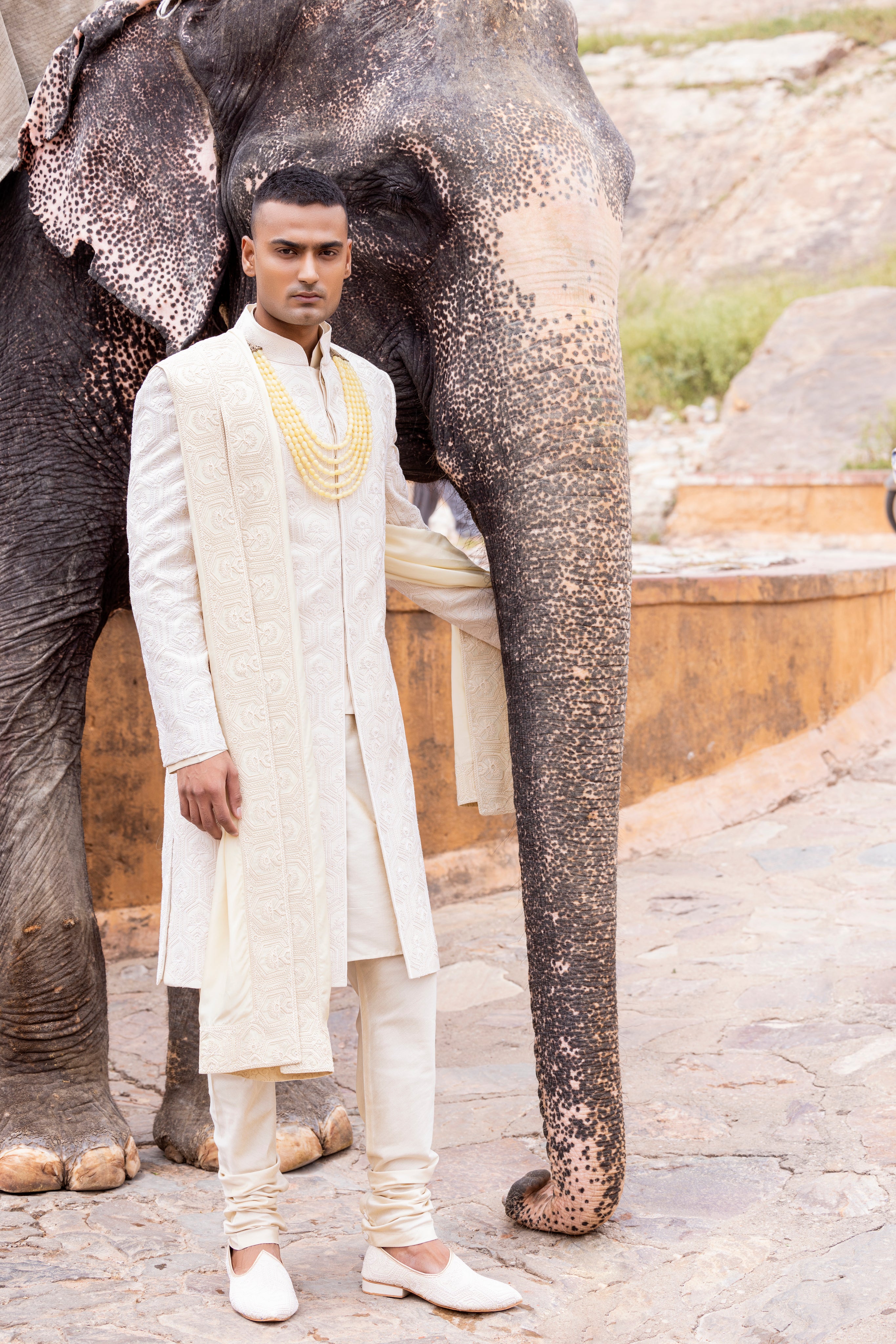 Hand embroidered sherwani paired with matching kurta, pyjama & stole.