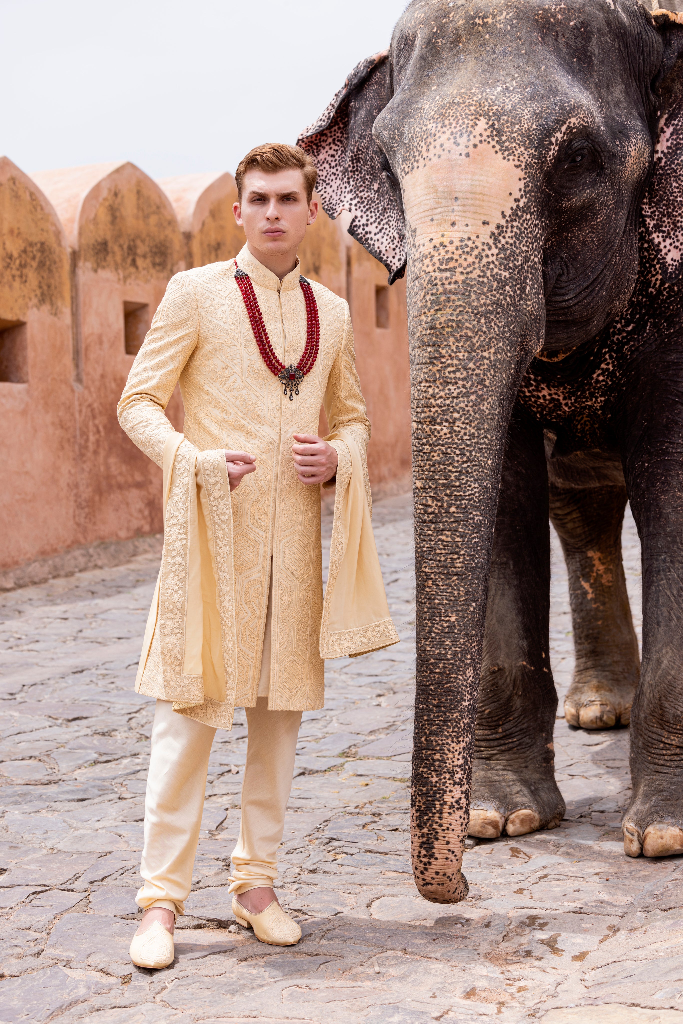 Hand embroidered sherwani paired with matching kurta, pyjama & stole.
