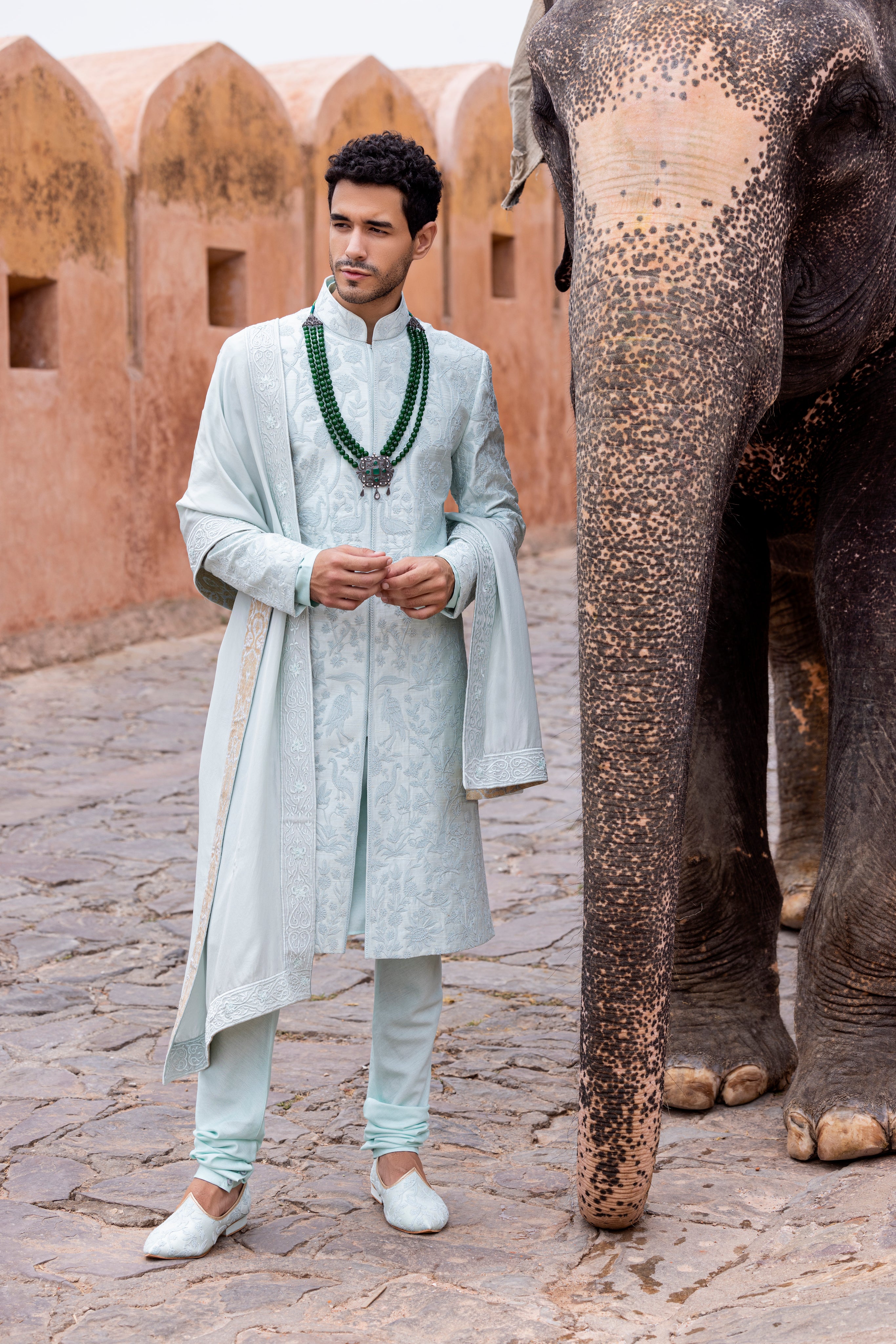 Hand embroidered sherwani paired with matching kurta, pyjama & stole.