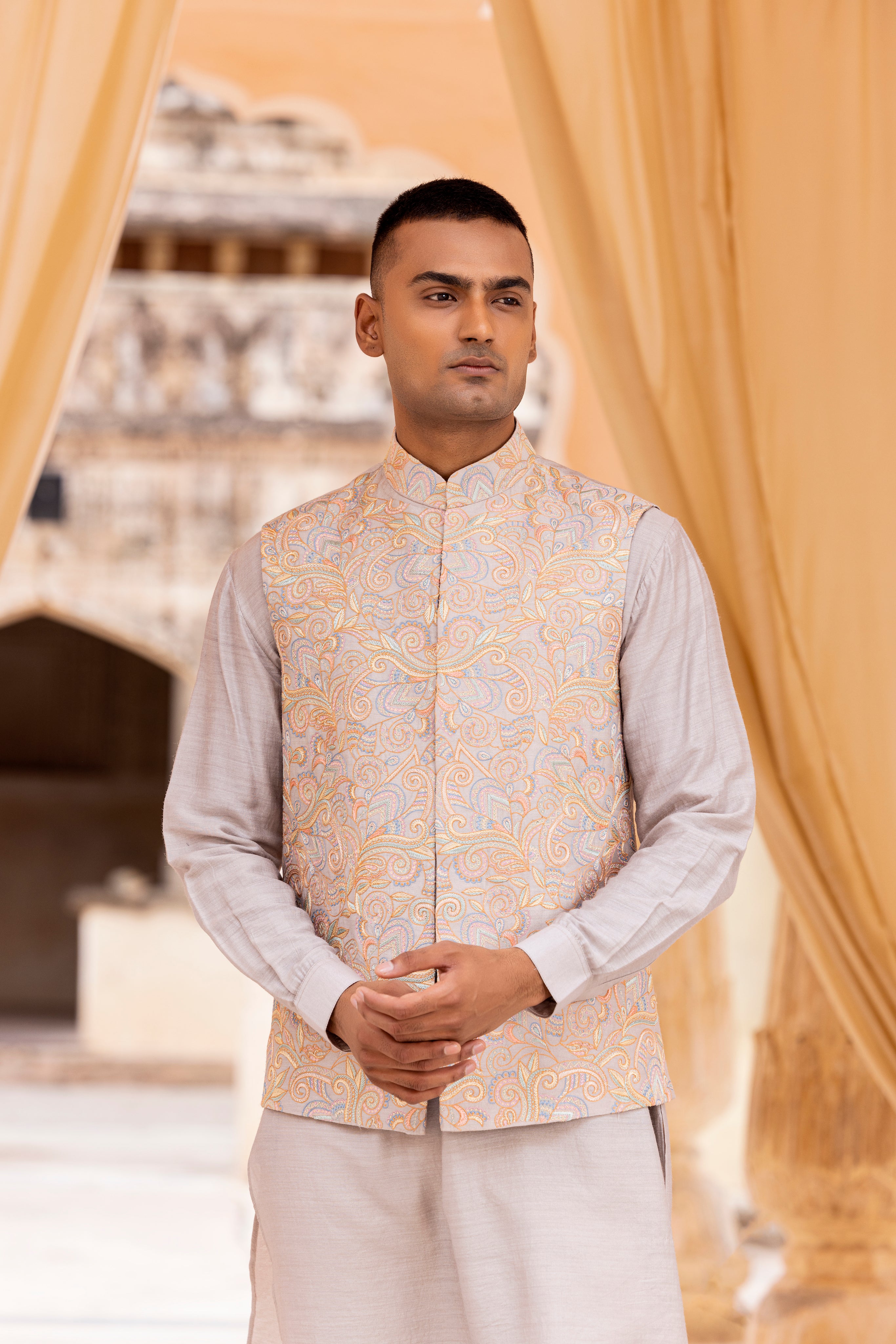 Kashmiri hand embroidery waistcoat paired with kurta and aligadhi.