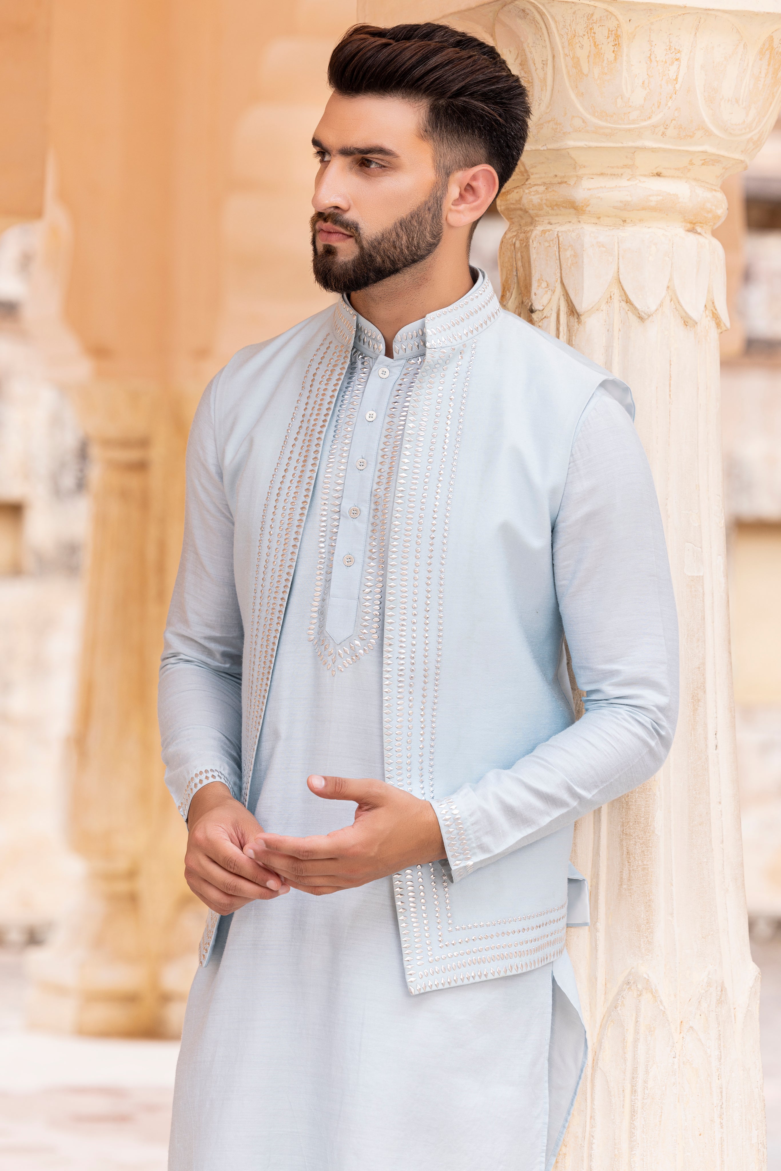 Metal work waistcoat paired with metal work kurta and aligadhi.