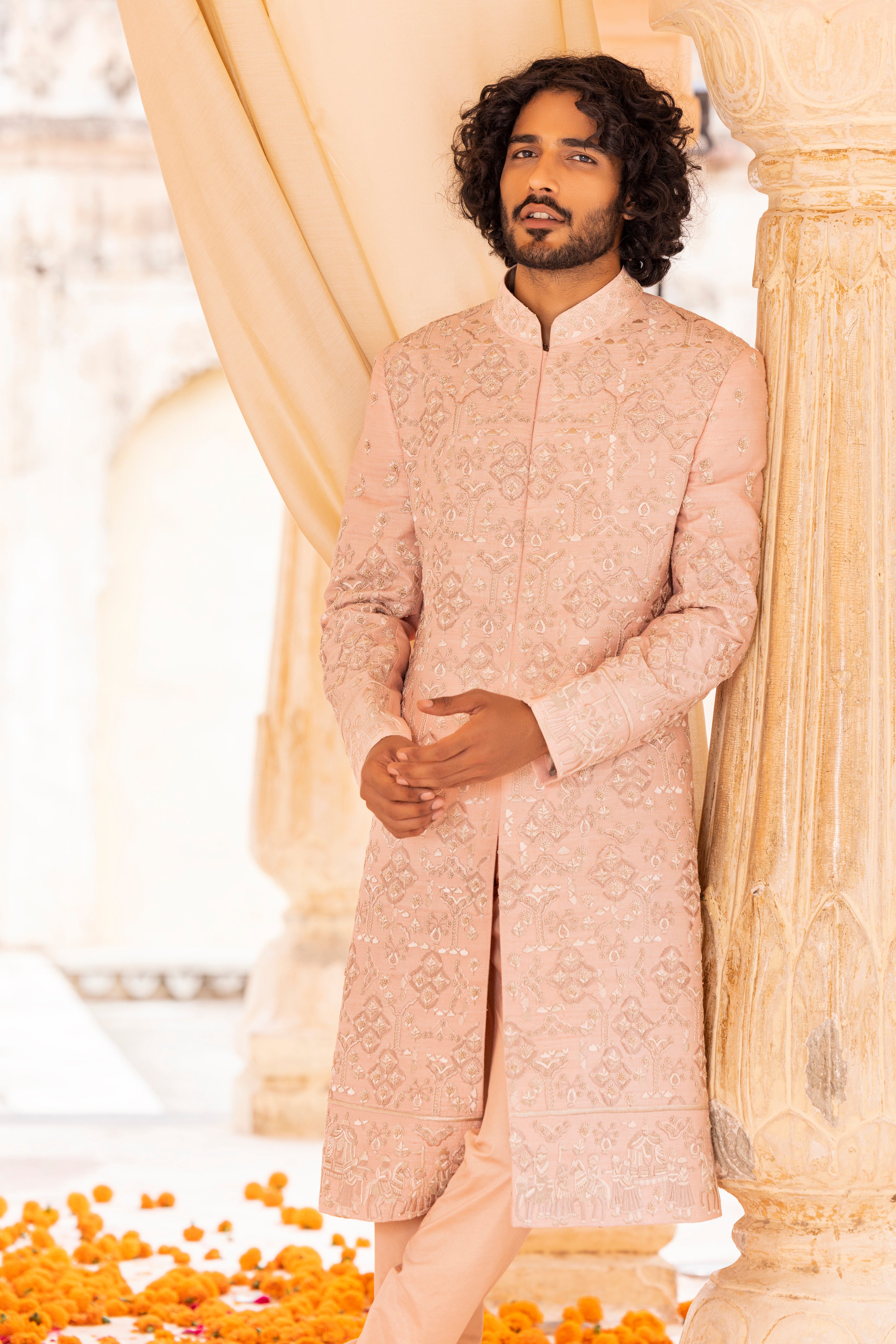 Hand embroidered sherwani paired with matching kurta, pyjama & stole.