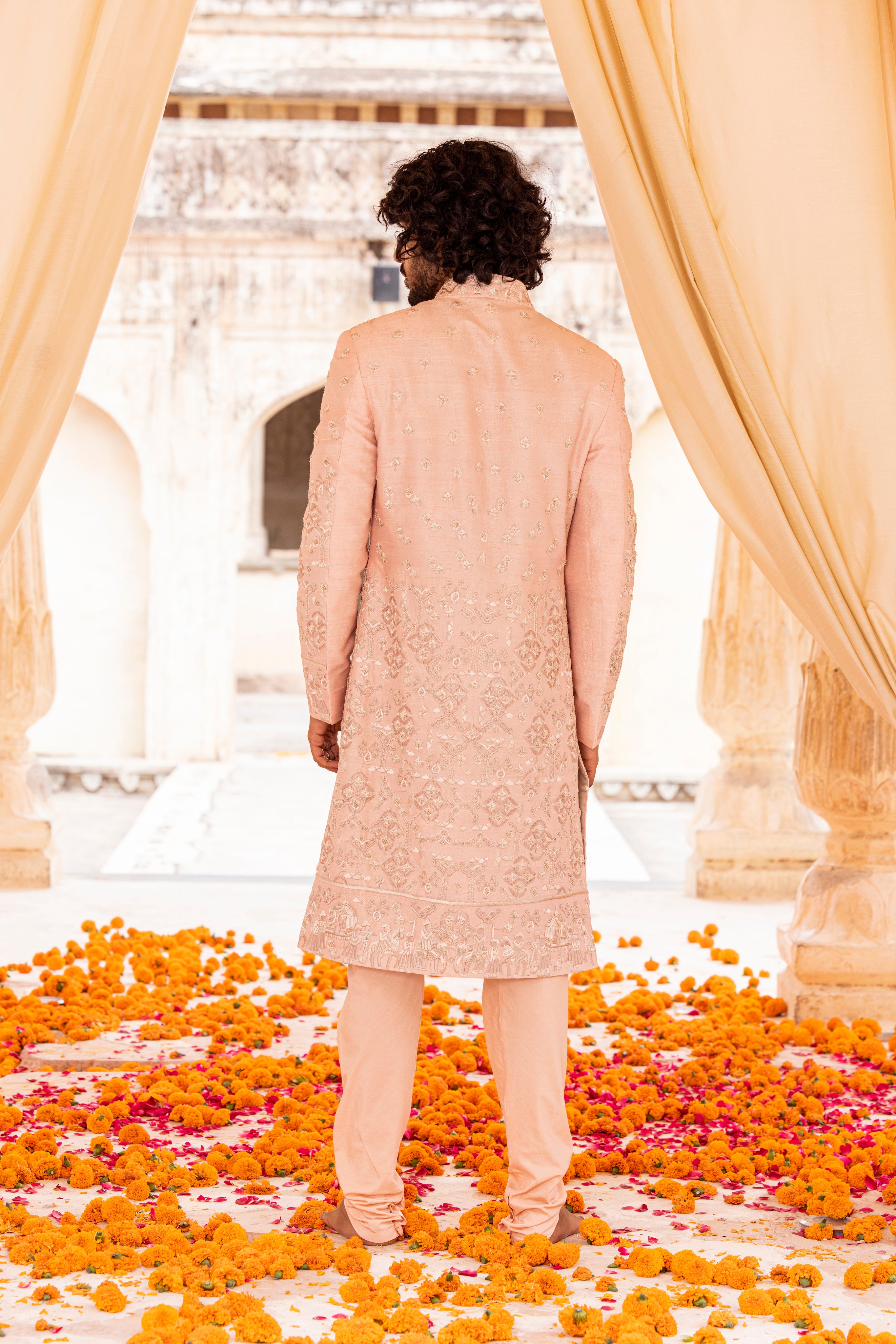 Hand embroidered sherwani paired with matching kurta, pyjama & stole.